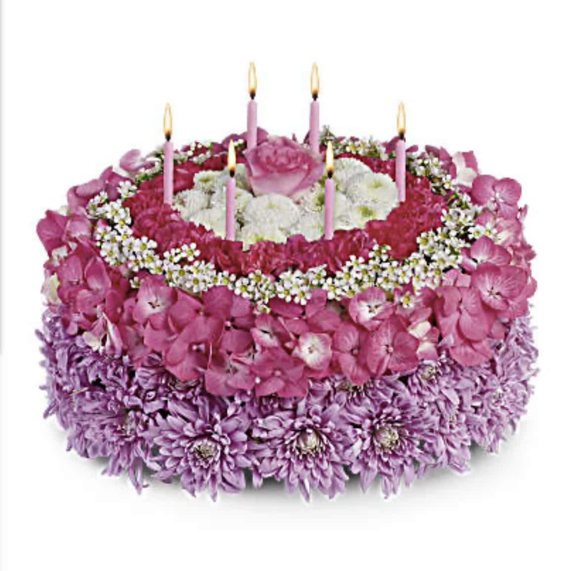 Your Special Day - Make a wish! Instead of a calorie-packed cake, send the birthday star a birthday cake of flowers. This unique arrangement features happy shades of pink, purple and white. And no birthday cake's complete without candles! Pleasing lavender cushion mums, pink hydrangea, white waxflower and button mums are sculpted into a round flower cake that's topped with six birthday candles. Orientation: All-Around ***You can vary the colors, just add your special instructions***
