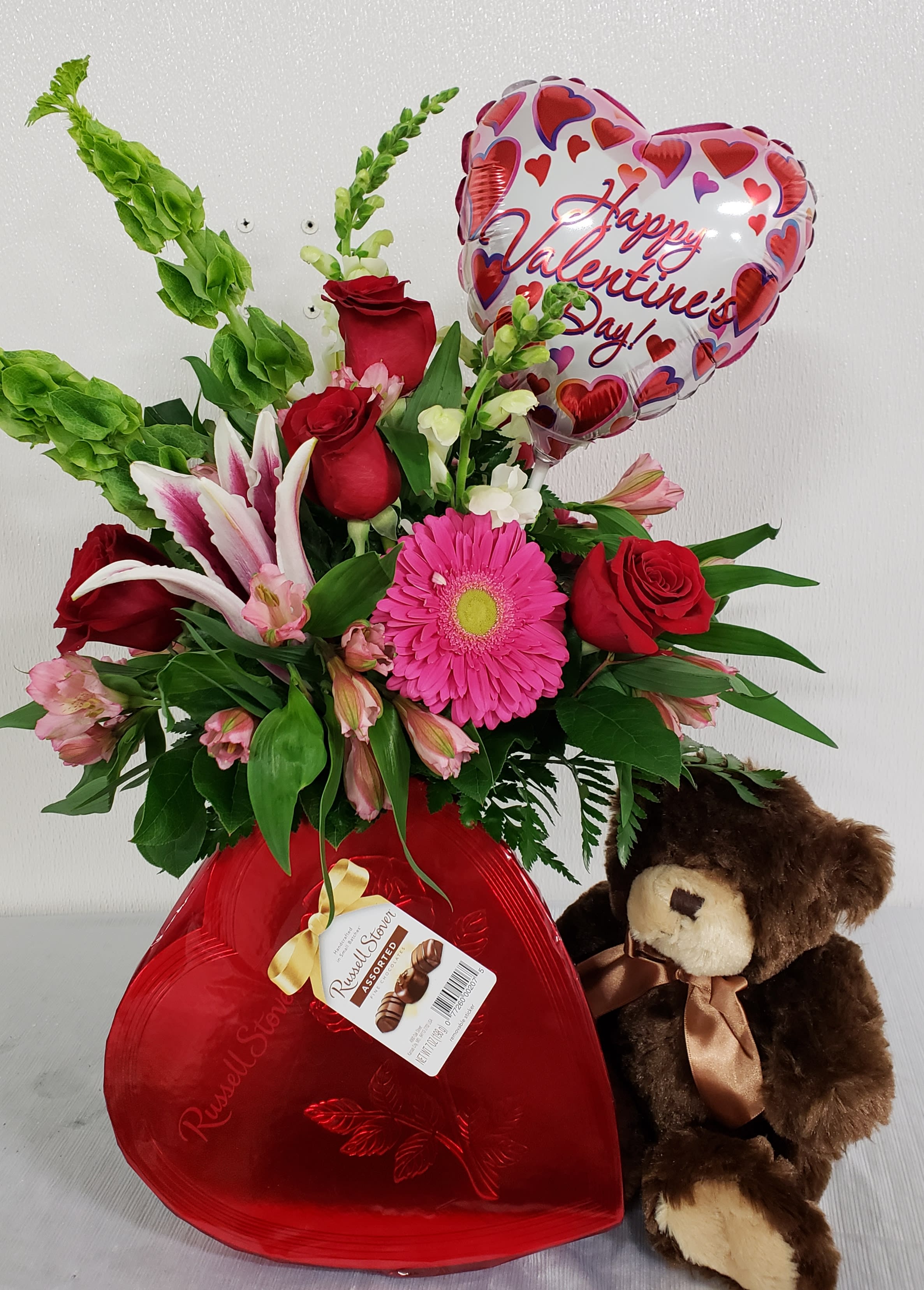 Valentine Package - This package includes, a fresh Valentine arrangement, Teddy Bear ( color of bear may vary ) and box of Candy