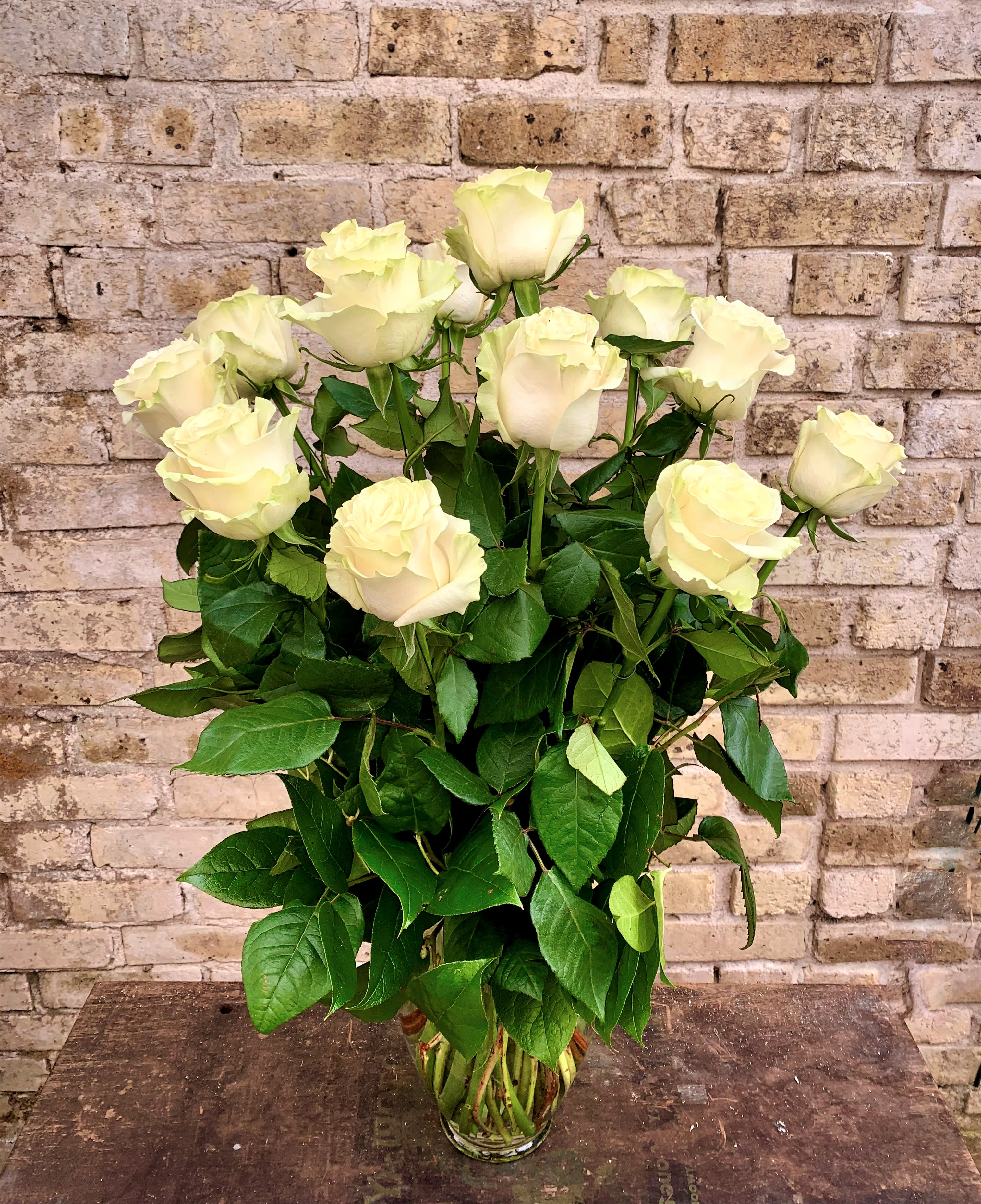 Playa Blanca - One Dozen White Roses Arranged in a Vase With Greens. Simply Beautiful. 