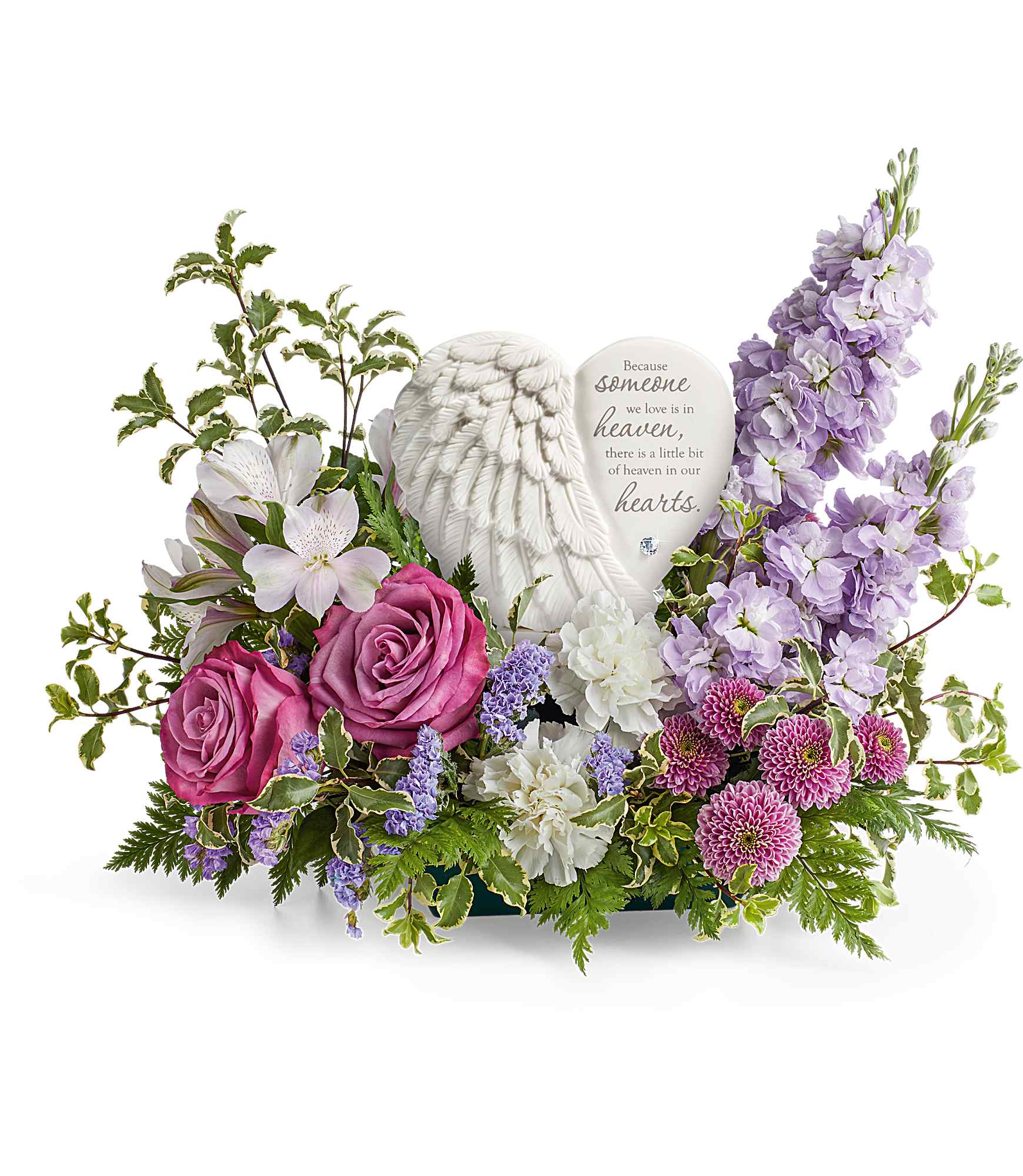 Remembering Love - A heartfelt tribute to a cherished life, Teleflora's Remembering Love Bouquet surrounds Teleflora's Heaven's Heart Keepsake with an elegant mix of soothing blooms. Featuring a delicate angel wing design and a touching inscription, this beautiful keepsake offers comfort, love, and a lasting reminder of precious memories.