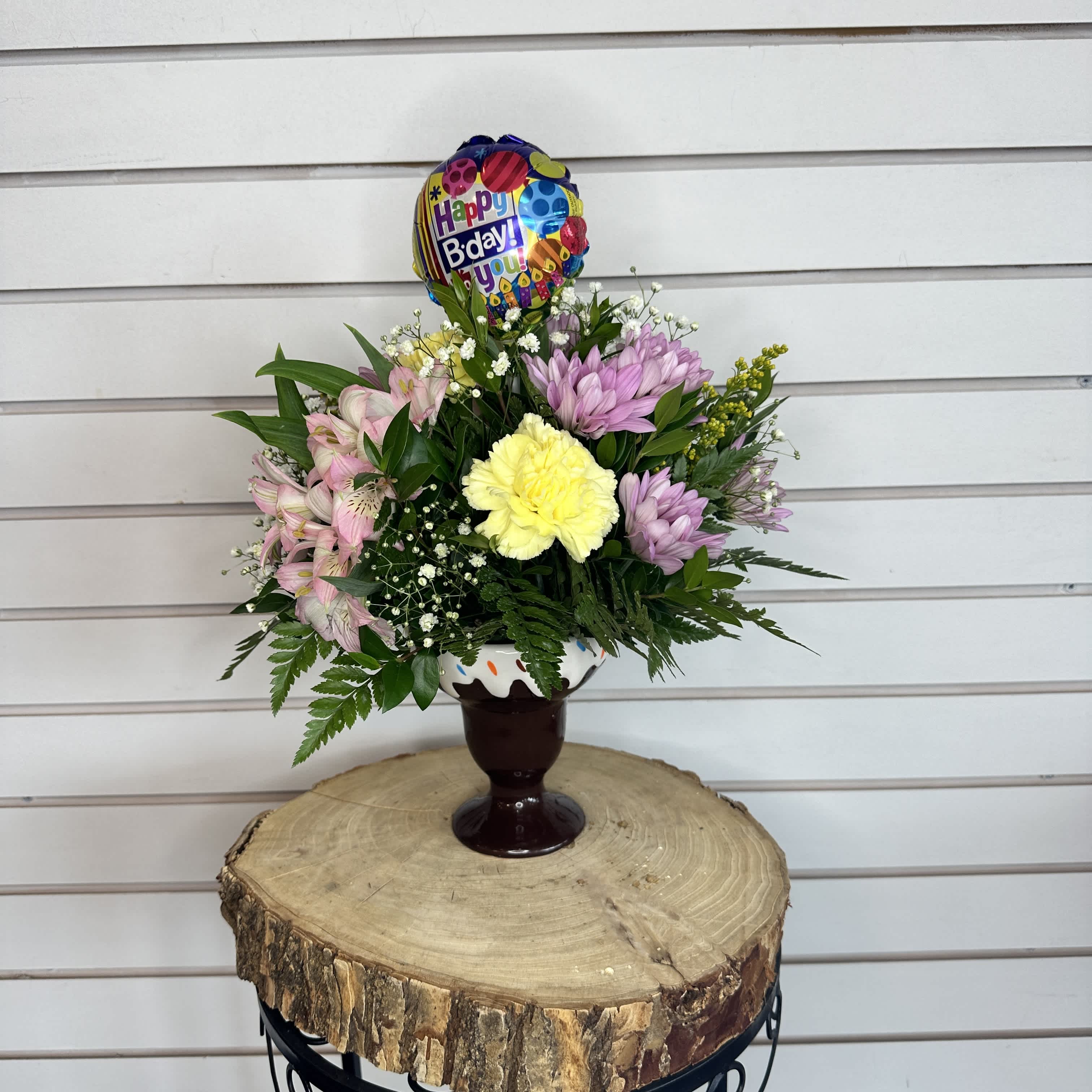Birthday Sundae  - A ceramic ice cream sundae container with a classic mixture of blooms, paired with a happy birthday balloon.  **colors and flowers may vary depending on shop availability**