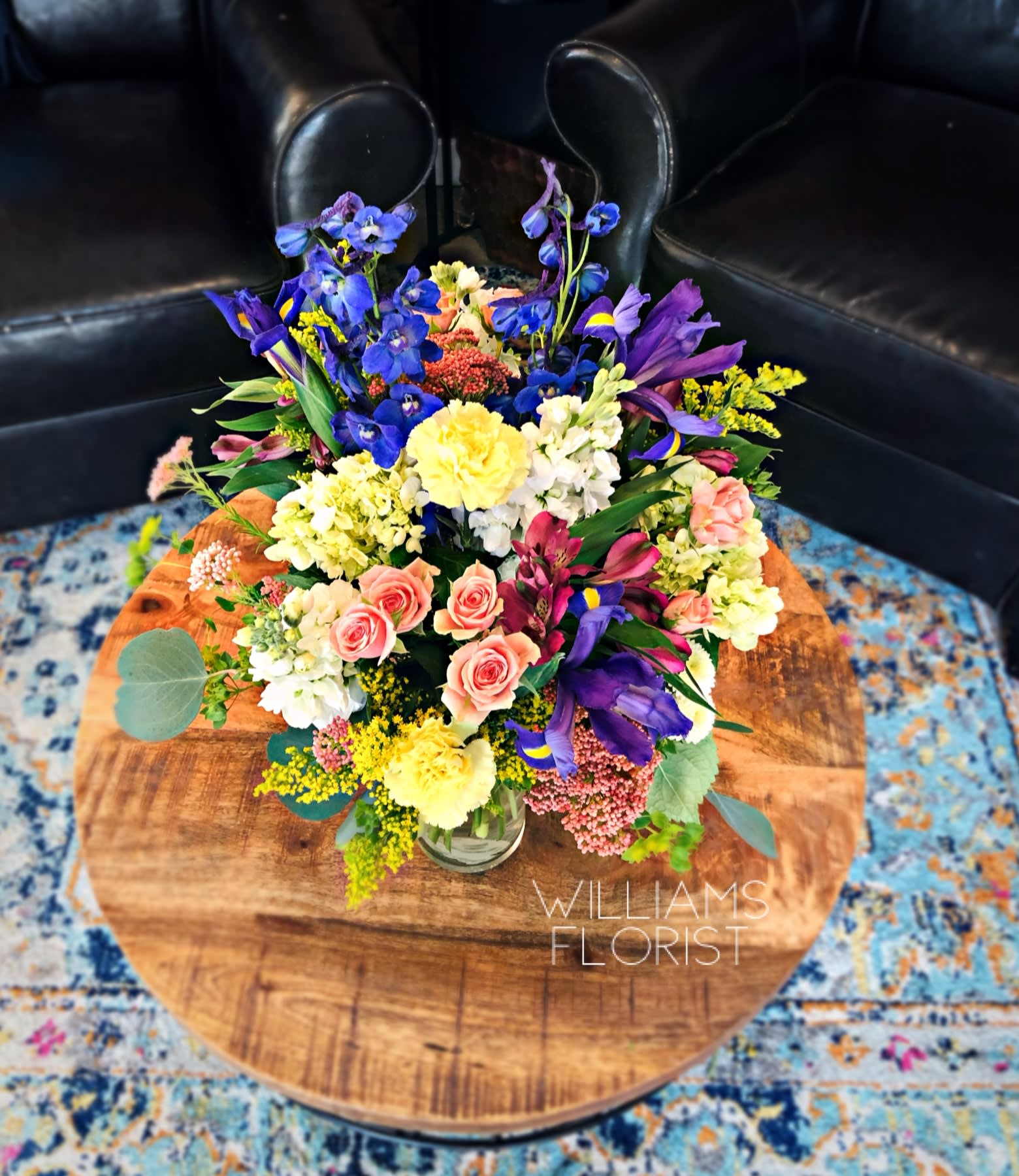 Fields of Europe - Shown in Regular size. Our best-selling seasonal bouquet is inspired by the traditional hand tied arrangements found in flower markets throughout Europe. Gathered with a mix of vibrant blooms inside a classic glass vase, it brings a bright and cheerful taste of old-world charm to every springtime celebration. 