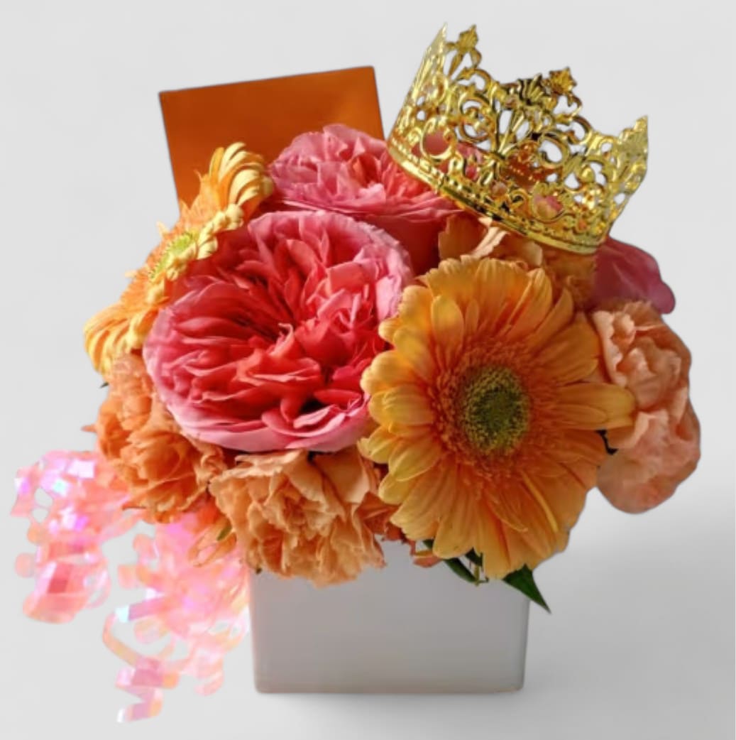 Peach Blossoms Beauty Designer's Choice - Send this pretty beauty today to let them know that you are thinking of them with it's lovely peach colored blossoms of that day roses and more arranged in a white modern glass vase adorned with a gold crown. Perfect for every occasion to send to make them smile. All bouquets are always made extra special and unique each and every time. Please check out my beautiful gallery to see my latest designs that I have created for my online customers. Send them happiness today.