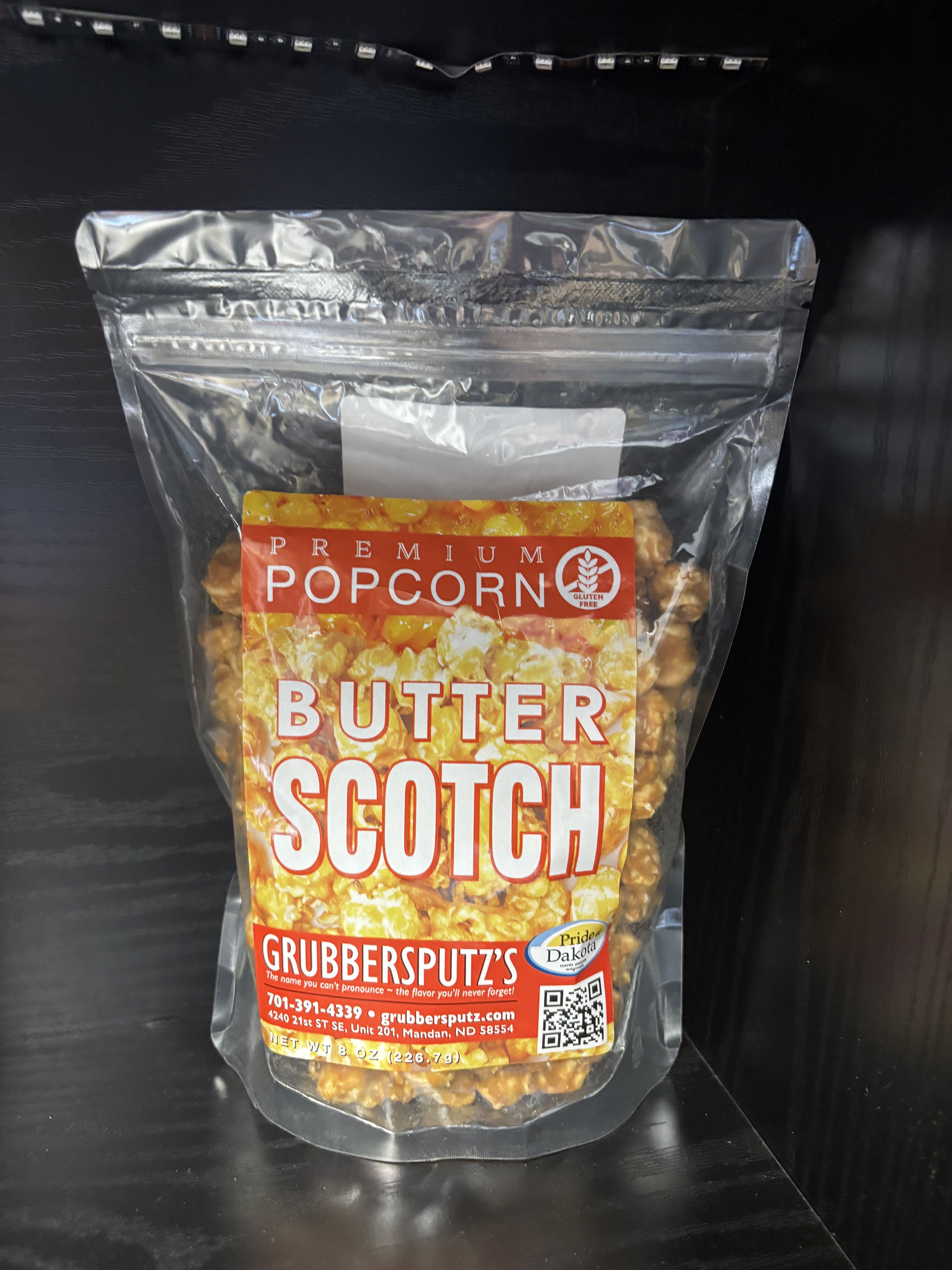 Grubbersputz’s Premium Butterscotch Popcorn - A rich, indulgent popcorn coated in a smooth, golden butterscotch glaze that delivers the perfect balance of sweet and buttery flavor. Grubbersputz’s Premium Butterscotch Popcorn is crunchy, satisfying, and irresistibly delicious in every handful. Proudly made in North Dakota and gluten free, it’s a standout treat for gifting, entertaining, or enjoying when you’re craving something sweet and nostalgic.