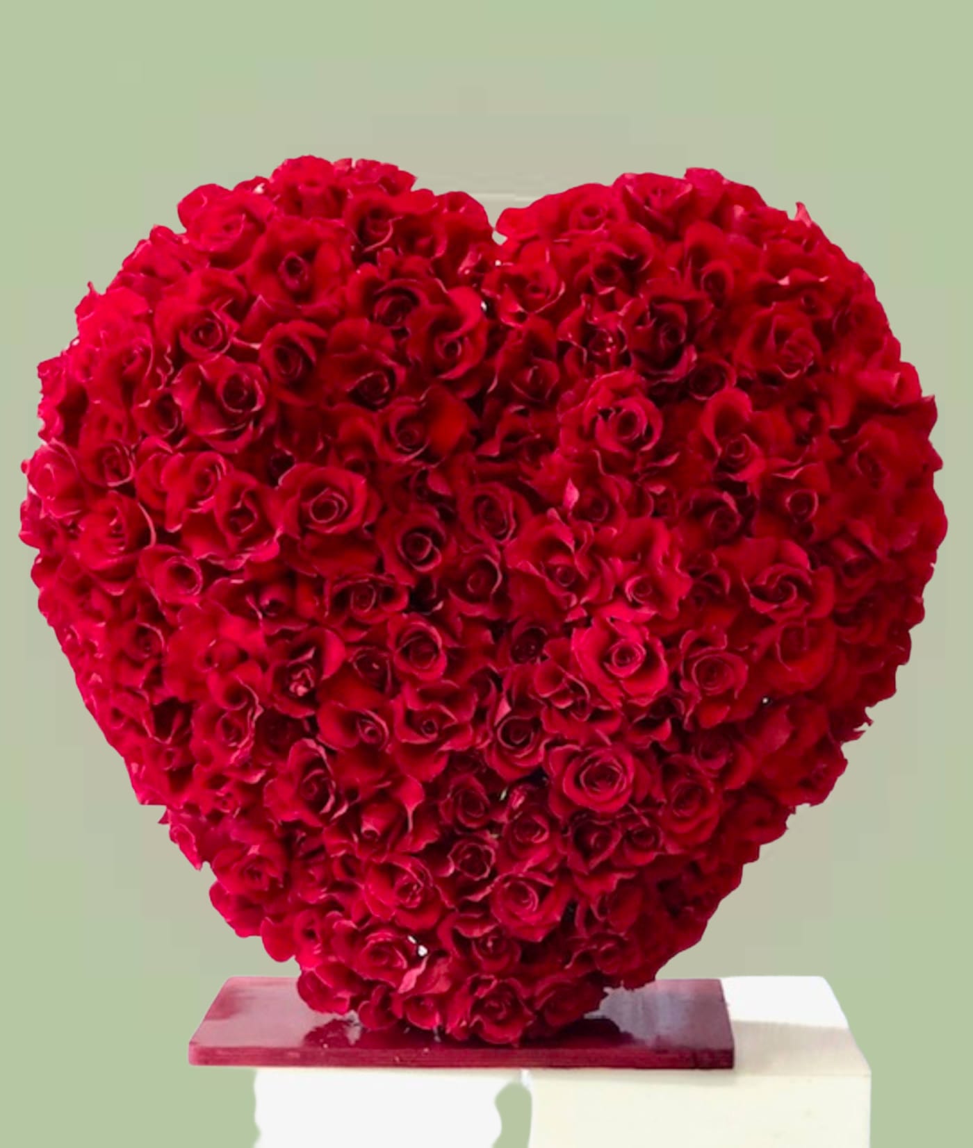 Red Eternity - Rose of the Heart premium classic red roses. Heart shape design is 30inch standing tall frame with lush vibrant red roses perfect for that special someone. Great expression of love and romance.   Same-day delivery available. Please allow additional preparation time due to the size and detail of this bouquet. Advance Order Recommended  Some florals are seasonal, if particular flower will not be available due to season, we will substitute for similar flower, composition, color pallet and value of the arrangements as closely as possible. All effort to create a floral arrangement as close to the photo shown, the actual arrangement may vary slightly in its appearance from the photo shown. If you have any questions about your order, we welcome you to call us or email.   