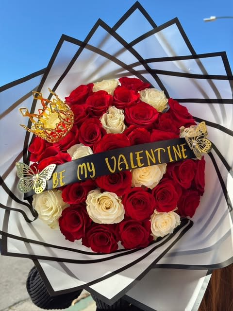 Royal Valentine - A luxurious arrangement of red and white roses, adorned with a golden crown and butterflies. The bold "Be My Valentine" ribbon makes it an extraordinary expression of love. 