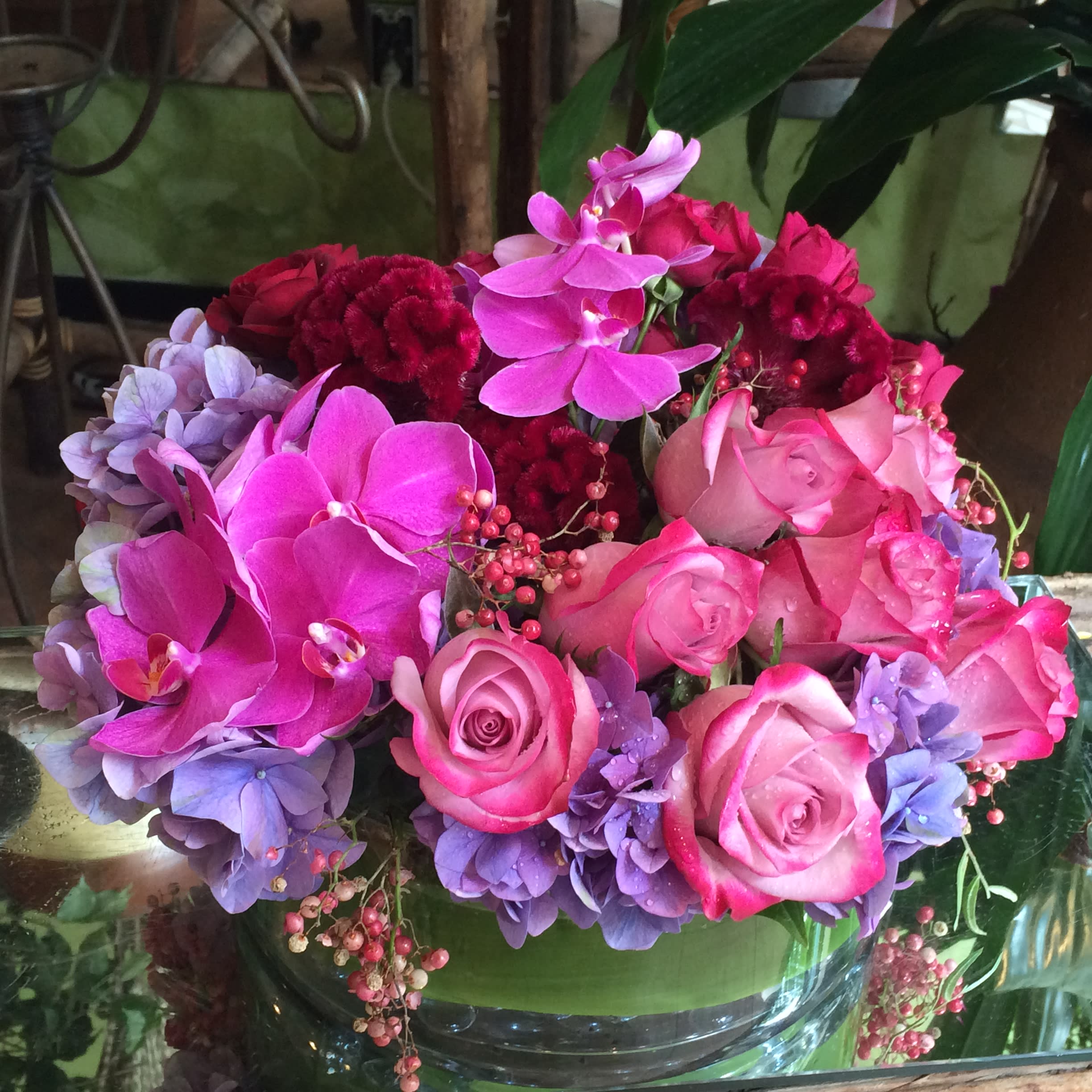 Holding on to you - Make someone feel truly special with this vibrant and romantic arrangement reds, pinks, and purples.