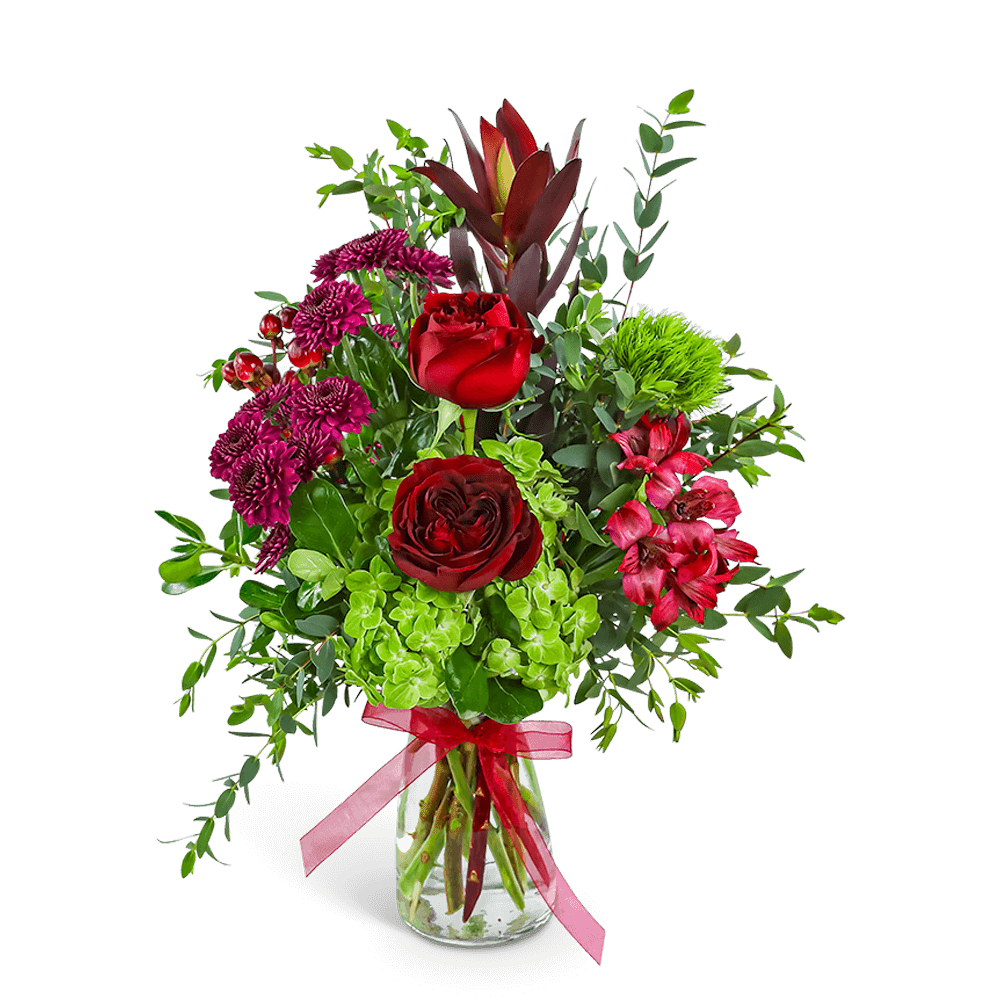 Velvet Rosewood - Velvet Rosewood is a romantic arrangement featuring lush Roses, Alstroemeria, Hydrangea, Mums, Safari Sunset, and Hypericum Berries in rich, jewel-toned hues. Designed in a clear vase with a ribbon accent, it's perfect for sending love through flower delivery or brightening up a special space. Our expert floral designer may make substitutions while keeping the same luxurious feel.