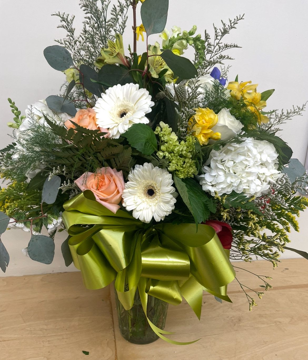 Always On My Mind by Lotherington's - Show your appreciation with this sweet, loving bouquet. This arrangement contains white hydrangea, orange roses, gerber daisies and yellow alstroemeria.  Perfect gift for Mother's Day, Birthday, or Just Because. APPROXIMATE DIMENSIONS: 14" H X 16" W  **Colors and product maybe substituted depending on availability**