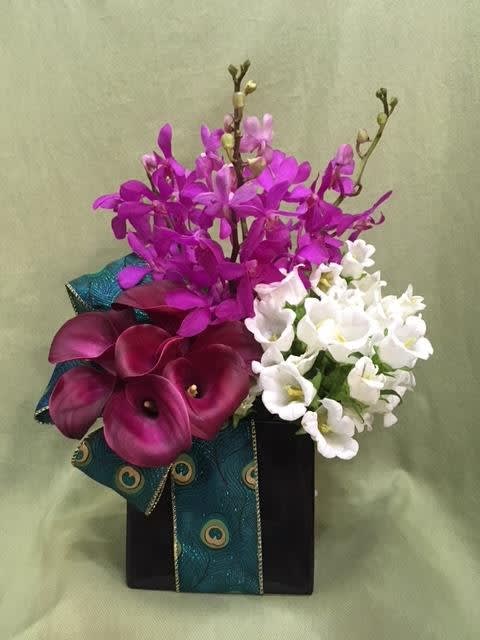 Tropical Love - 6 Purple Mini Calla Lilies , 5 stems of White Campanulas , 5 Purple Orchids in 6'' black ceramic container with ribbon 