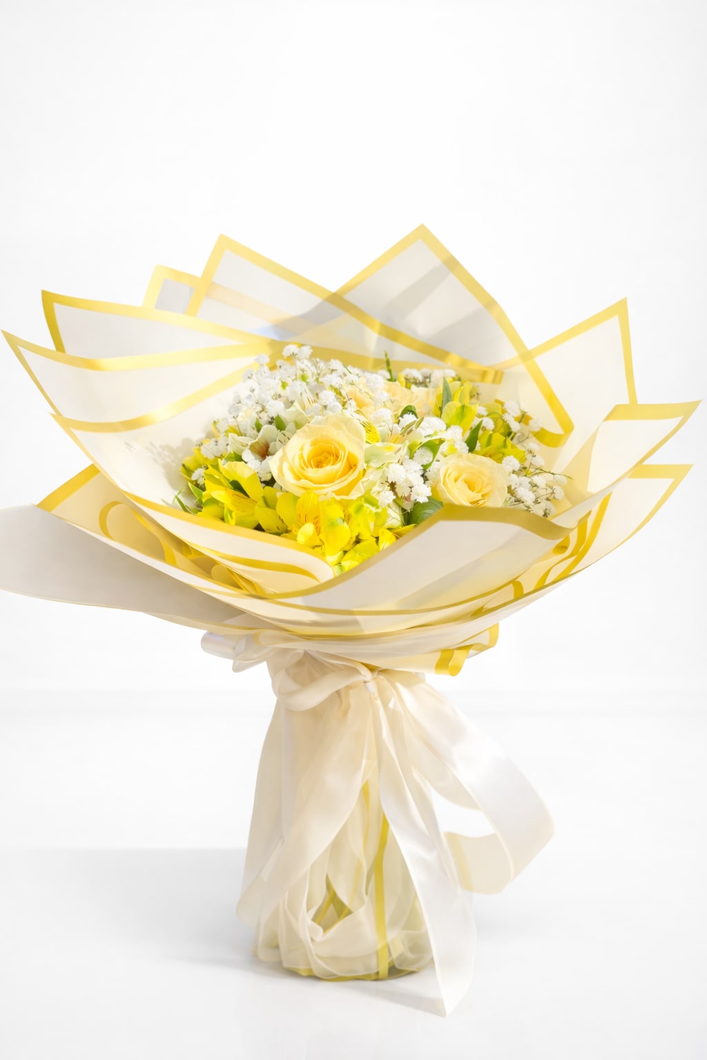Golden Glow -  bright and cheerful bouquet of fresh yellow roses, soft white baby’s breath, and seasonal greenery, wrapped in elegant ivory and yellow tones. Perfect for birthdays, thank-you gifts, congratulations, or simply to brighten the day. Hand-designed with care and available for same-day flower delivery in Carlsbad and surrounding areas.