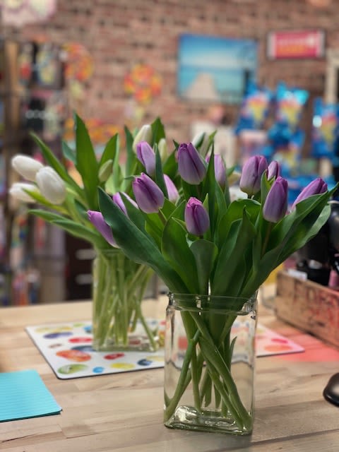 Tulips! - An assortment of tulips, in one color or complementing colors, in a container of our choosing. 