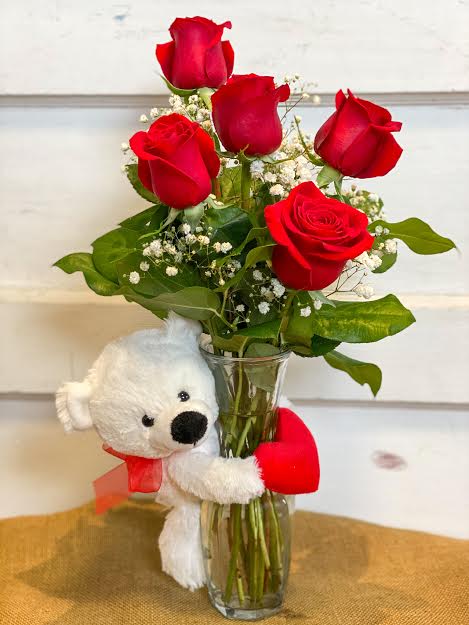 Bear Hug with Roses  - An adorable teddy with it's armed wrapped around a bud vase of roses.  Standard is hugging 3 roses **Shown is Deluze hugging 5 roses!  **Colors may vary!** 