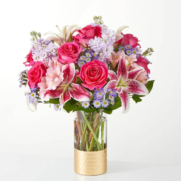 Pressing Petals Bouquet - The epitome of elegance, our Pressing Petals Bouquet is sure to make the gloomiest days brighter. Details The Exquisite Bouquet is approximately 19"H x 17"W. Designed by florists, ready to display. For long–lasting blooms, replace the water daily. We suggest trimming the stems every couple days. Pet Safety Precautions: This bouquet or plant may include flowers and foliage that are known to be toxic to pets. To keep them safe, be sure to keep this arrangement out of your pet's reach.