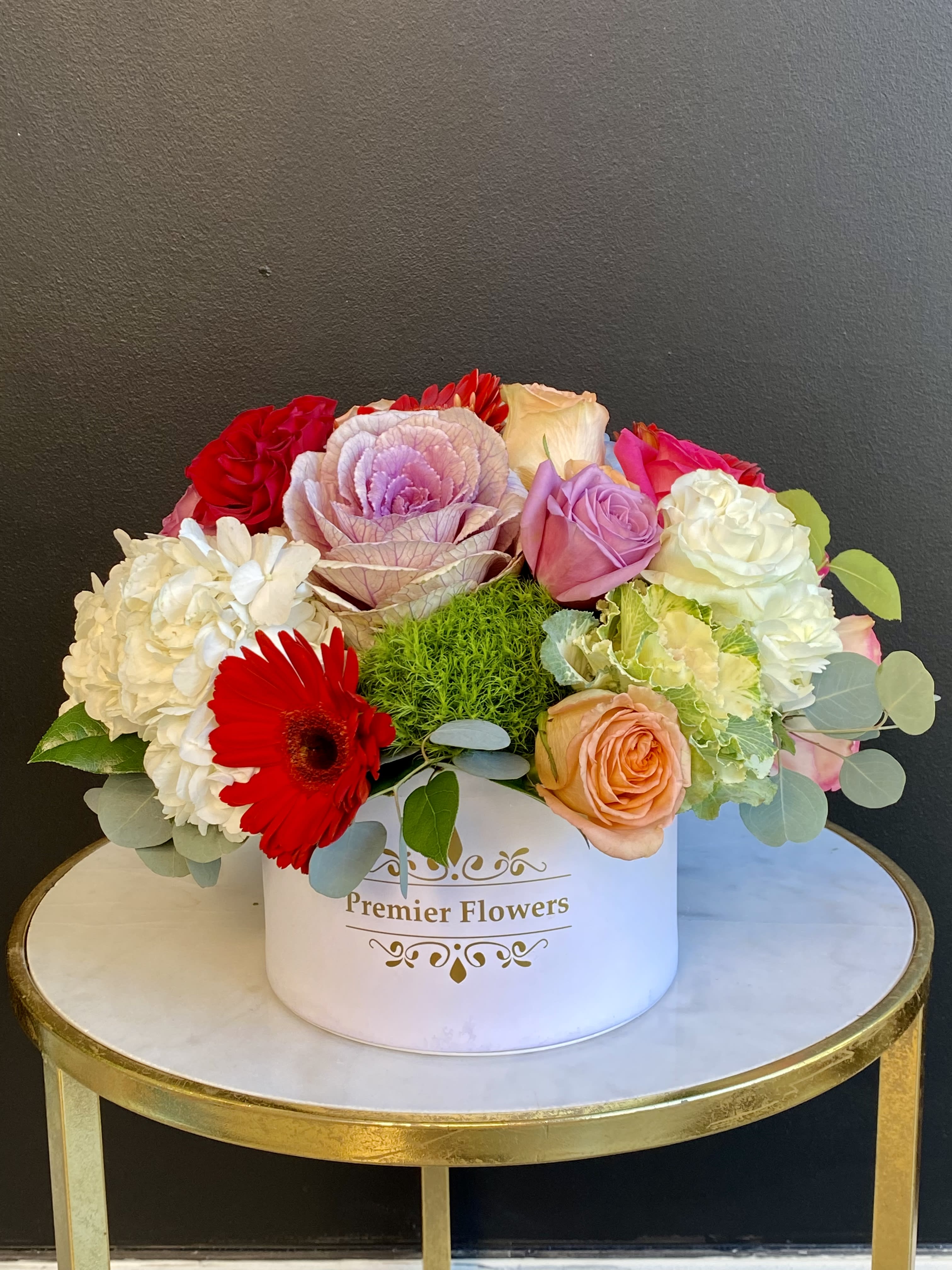Fleur Box - This signature flower box of love featuring an assortment of Roses, Hydrangeas, Kale, minimum greenery for a cleaner look, and other flowers that are available at the time of ordering. Send this luxury item for any occasion.   *Boxes may vary.