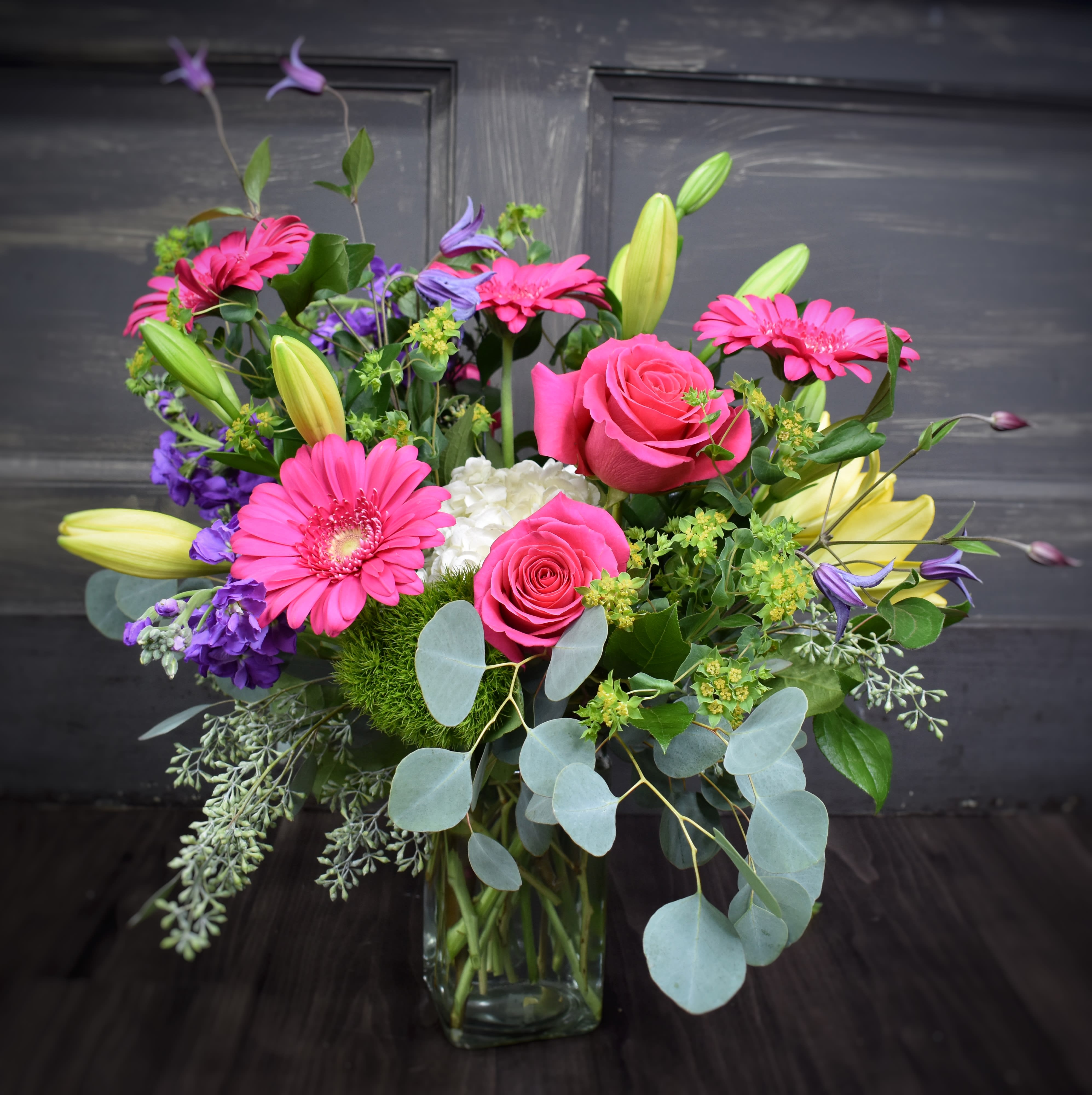 My Mom's Garden - A beautiful collection of brightly colored blooms make the perfect gift! Our most popular design includes A pretty mix of lilies, roses, gerbs etc. ***Colors may vary from the picture