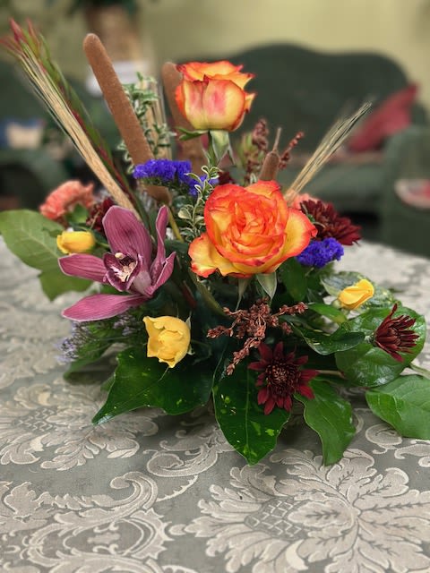 Fall High and Magic - High and Magic Roses, orchid, carnations, spray roses, mums, statis, cattail