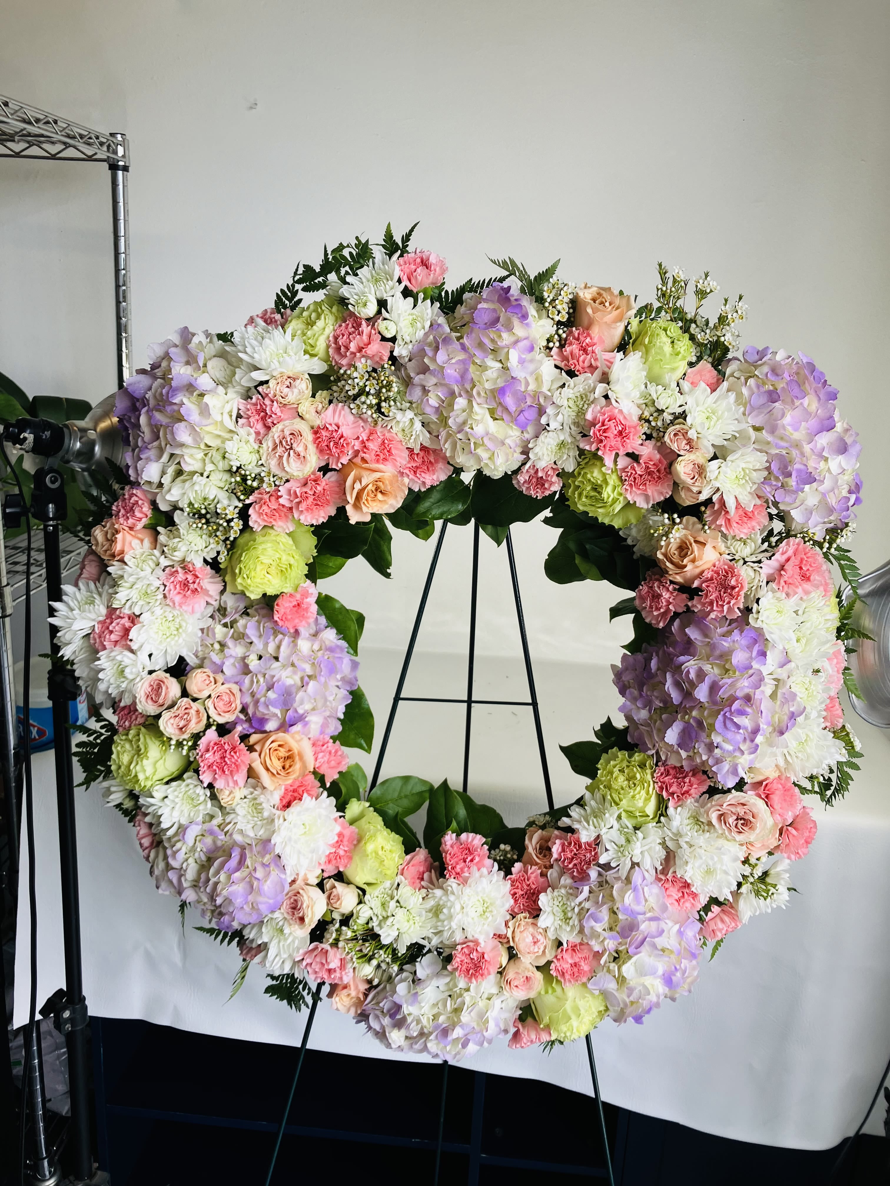 Delicate Spray - A Large Spray arrangement with a variety of flowers in all pastel colors for a soft and beautiful look. 