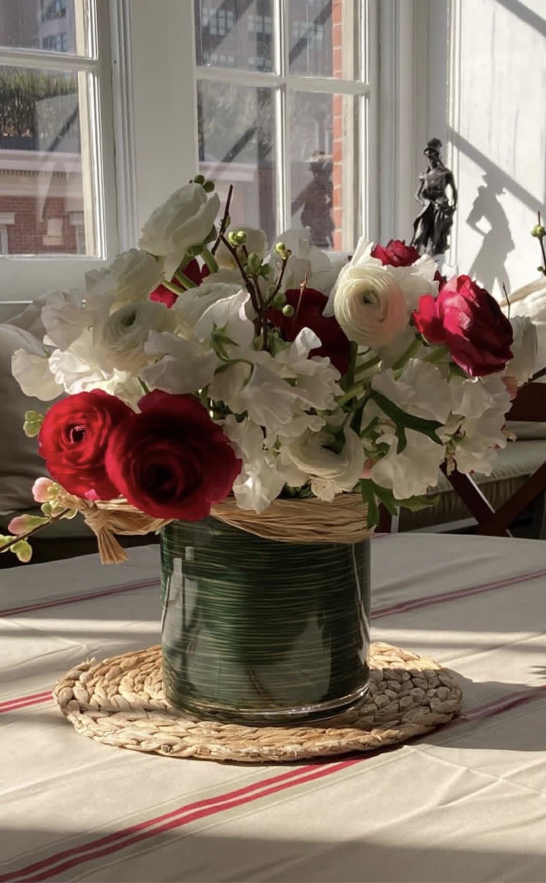 Mon Amour - Lush composition of sweet peas and ranunculus flowers in a low profile. 