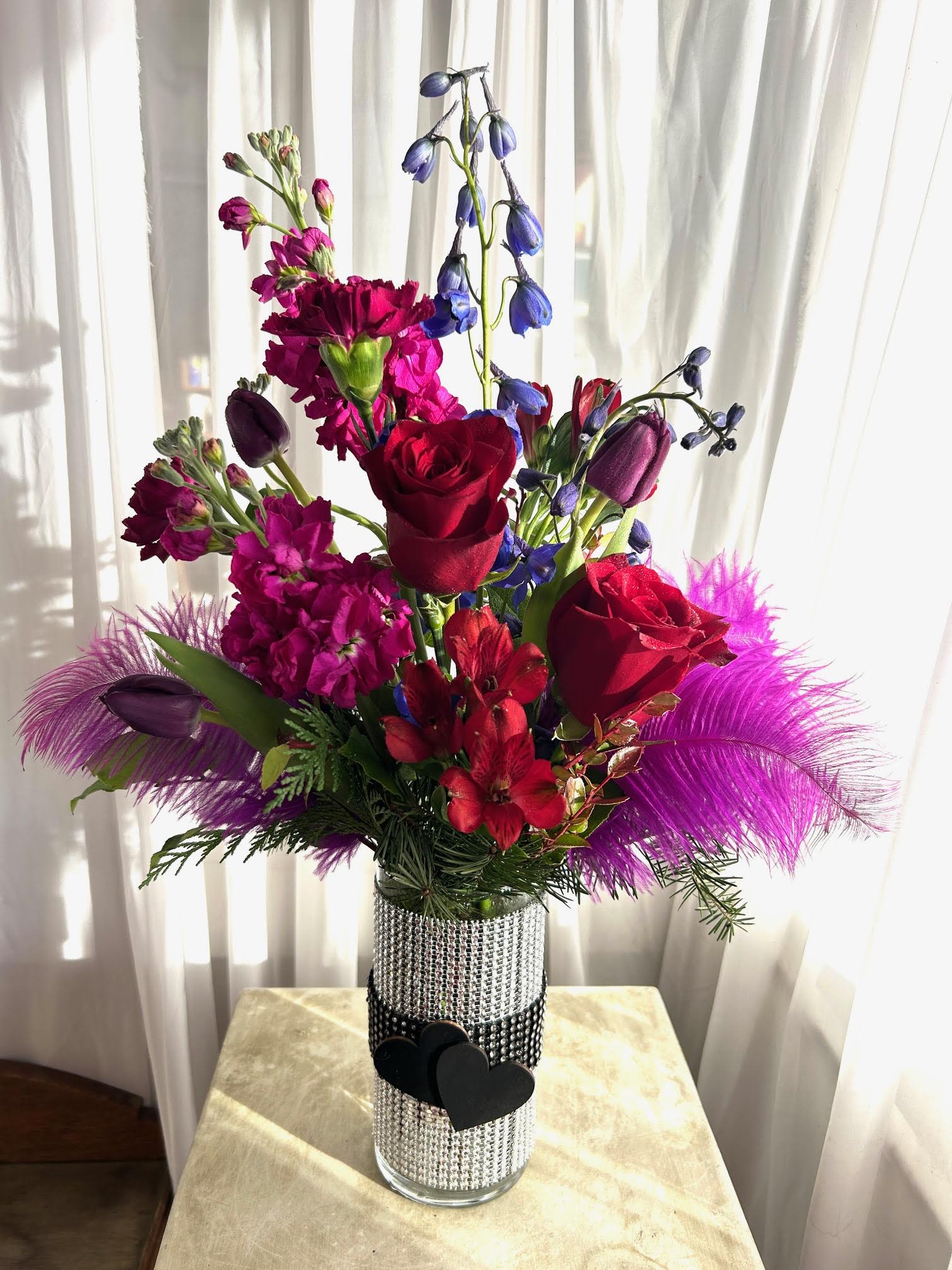 Cabaret - Jewel tone flowers combine in a dramatic rhinestone wrapped vase.