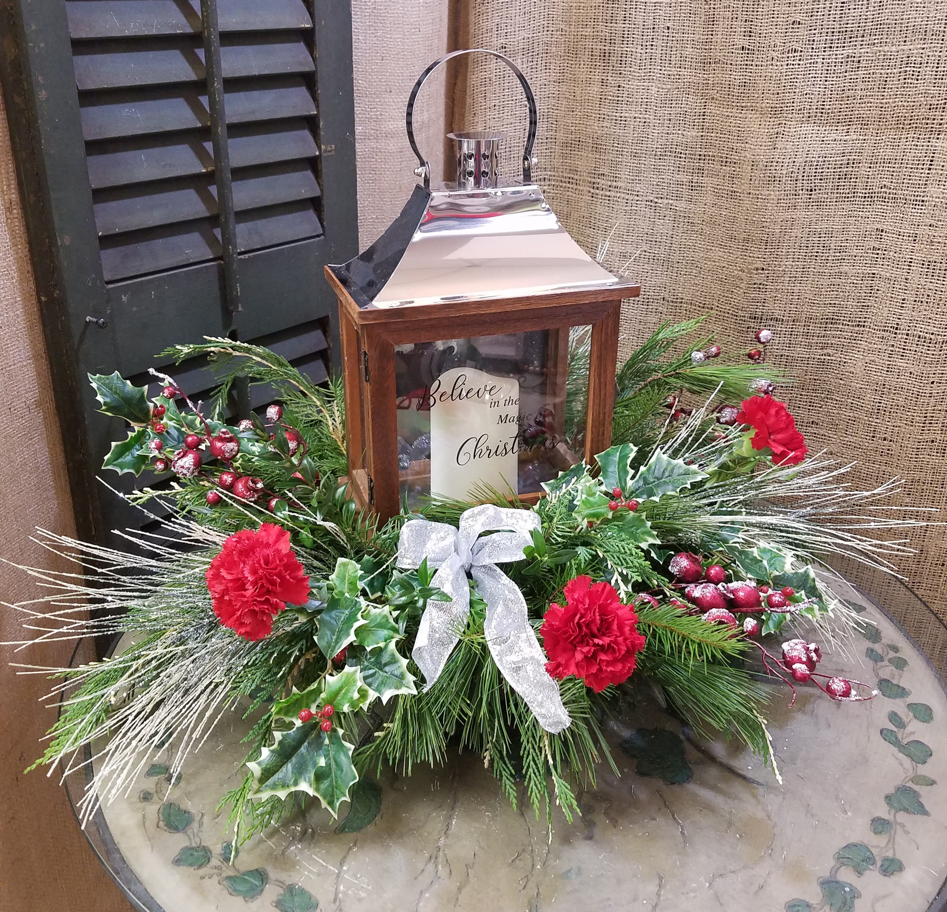 Christmas Lantern Arrangement  - This beautiful arrangement makes a great sentiment for any occasion with a keepsake lantern. Lantern may be a little different than pictured. 