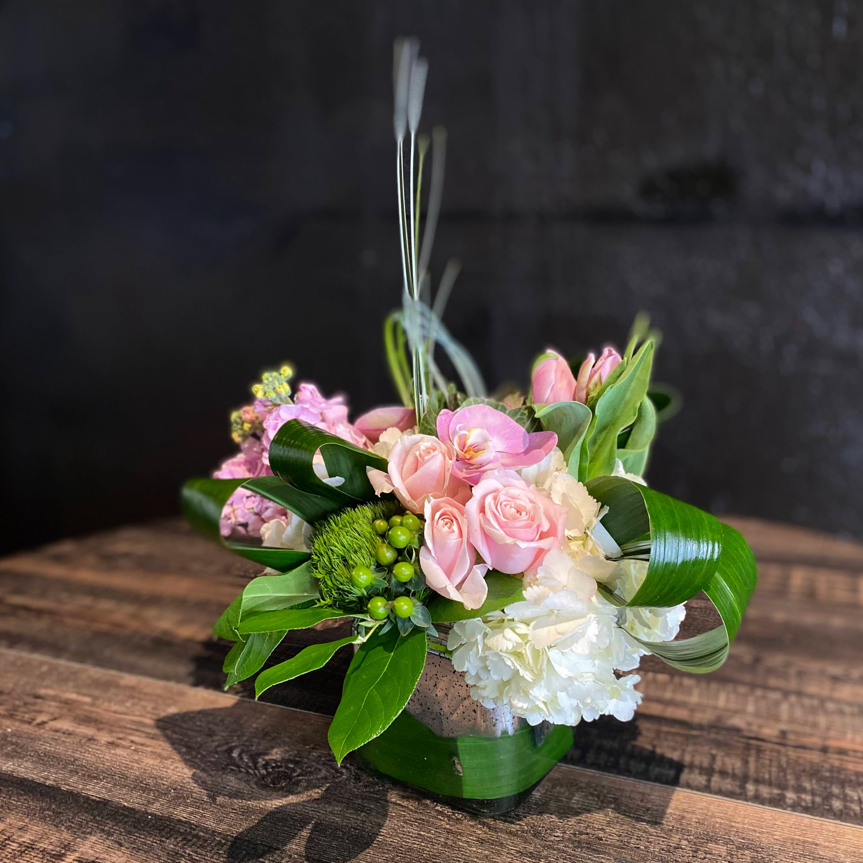 #7 You Make Ordinary Days Better - Like two peas in a pod, it doesn't matter what you do, as long as you do it together.  Soft and sweet color palette and fun grasses add some delight to this pavé arrangement. Designed inside a 5x5 cube with a touch of silver.
