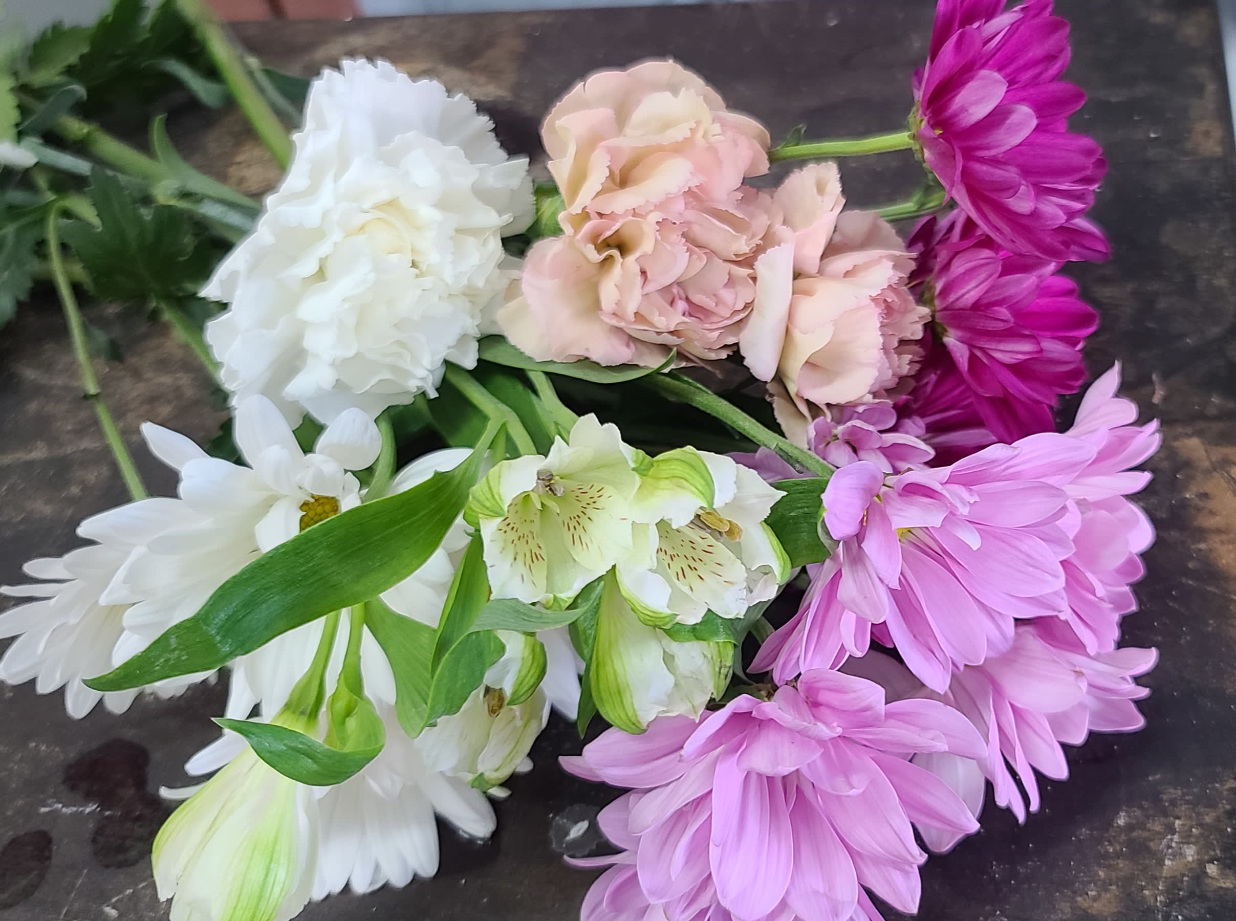 Designers Choice Standard Blooms - The classic blooms that last. Available year round in a multitude of colors. Gt the most bang for your buck with these beauties! Carnations, Daisies, &amp; alstromaria are always a hit. Please note a color or seasonal (spring, summer, fall) preference in the special instructions section when ordering. 