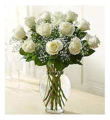 Dozen White Roses In Vase - A dozen white roses are a classic gift! Perfect for Valentine's Day, an Anniversary, or any type of celebration.  Approximate Dimensions: 20"D x 30"H