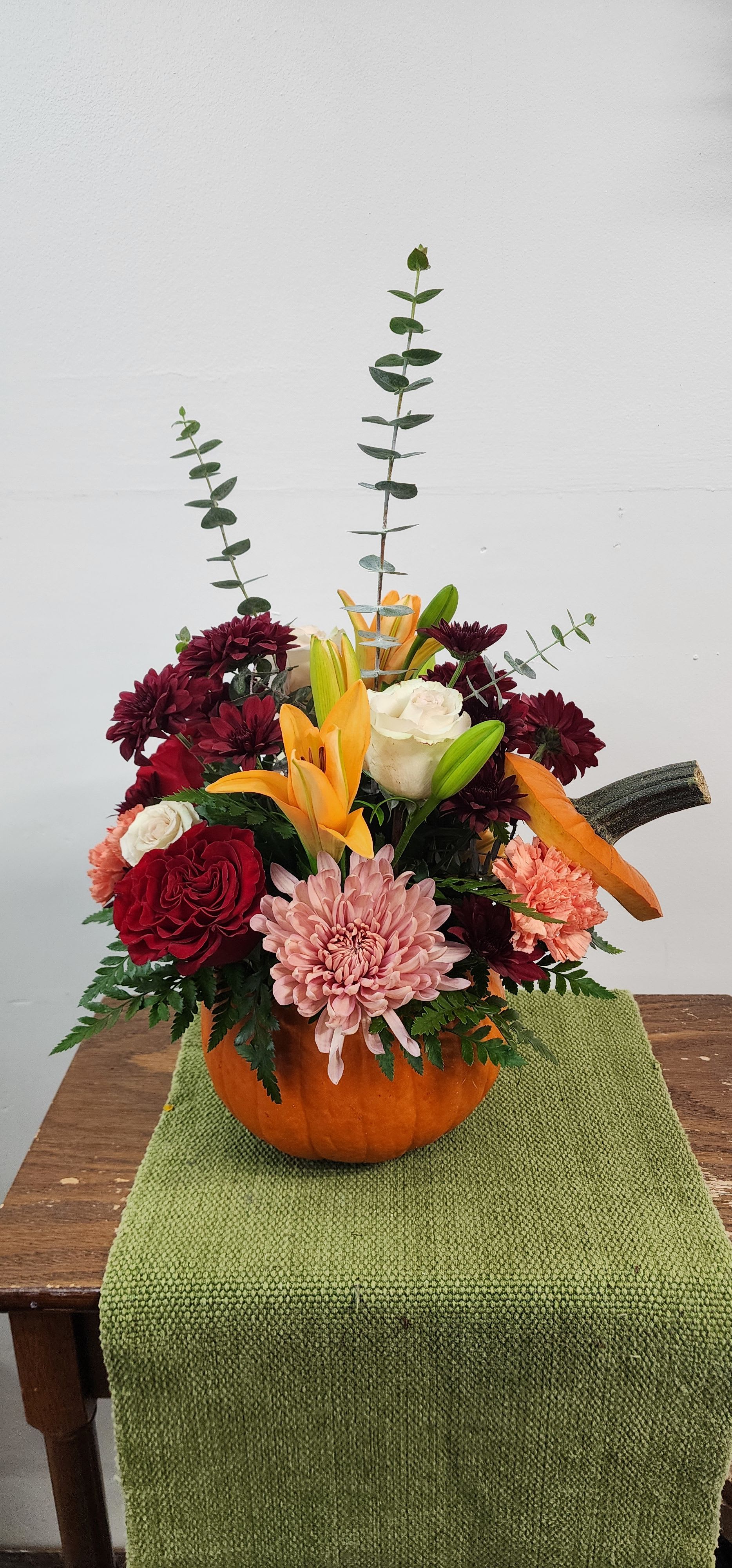 Fresh Pumpkin - Lilies, roses, and mums hold all the ambiance of fall, family and memories just wating to be made