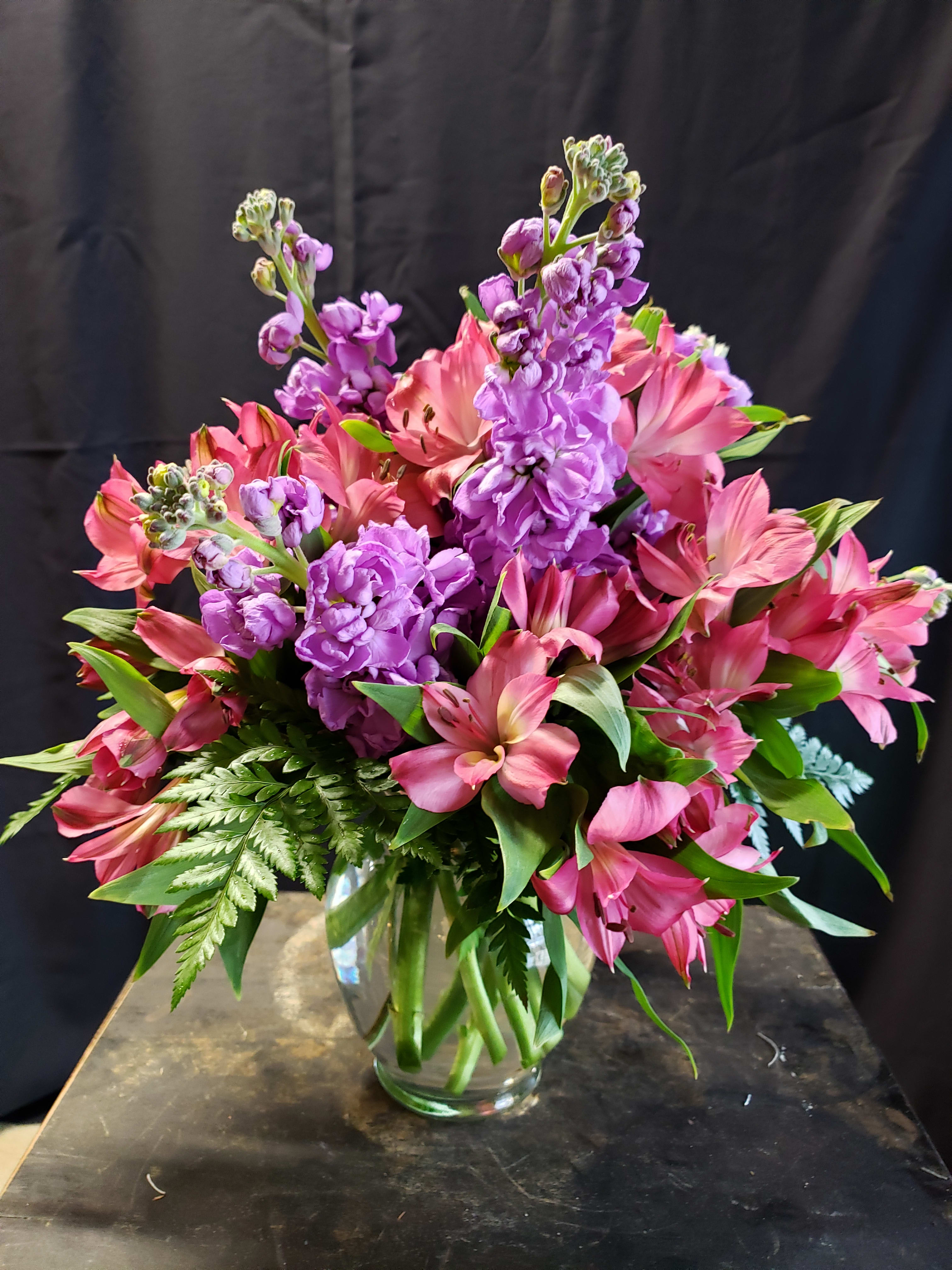 My Sweet Love - Delicious scented stock flowers in purple with everyone's favorite Peruvian Lily in pink in a beautiful ginger jar vase. This sweet arrangement looks great on a side board, as the centerpiece on a dining table, and will spice up any office.