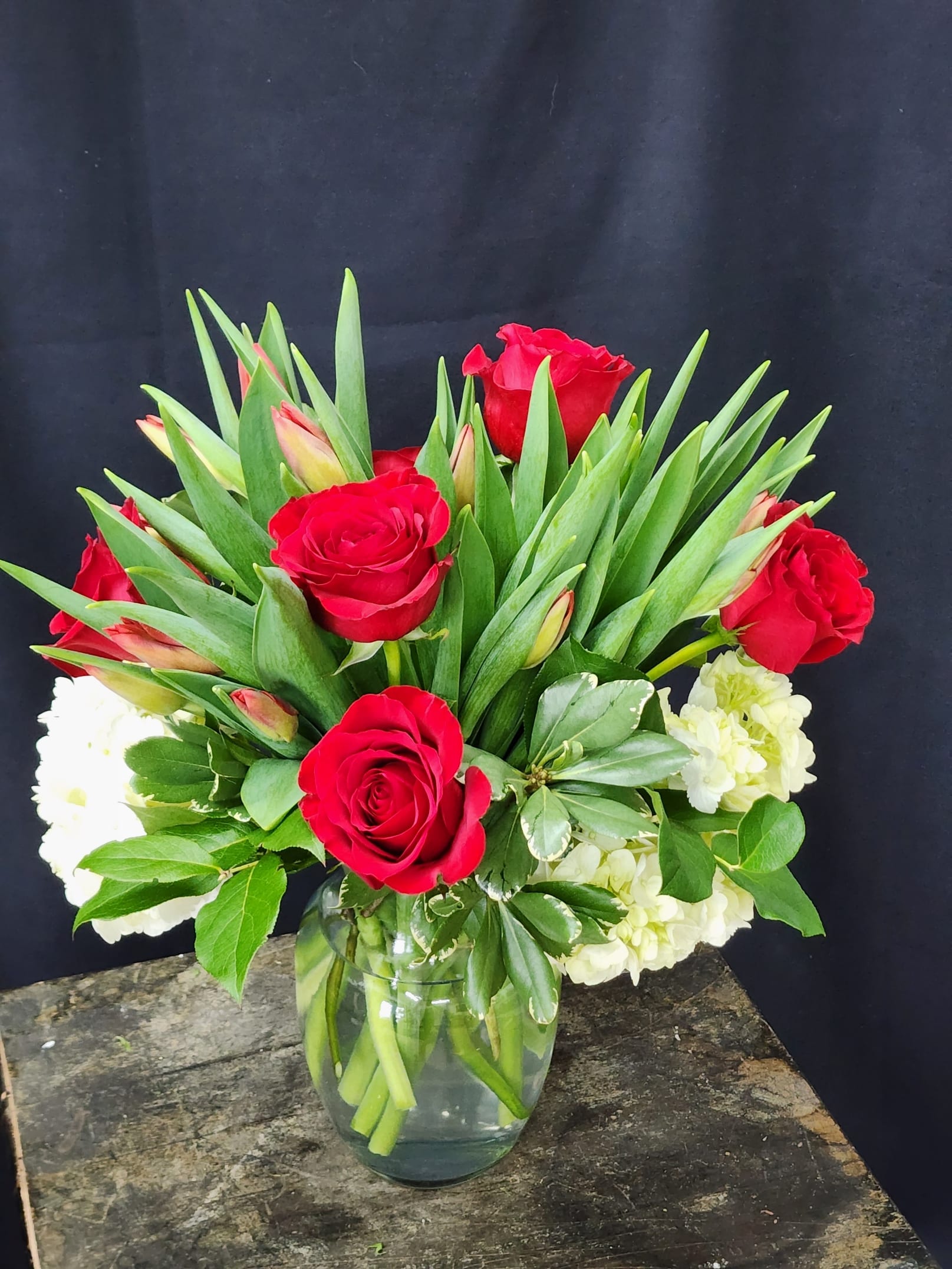 Tulips 2 Love - Tender Red tulips, lush Hydrangea and classic Red Roses  elegantly displayed for lasting love. Have them delivered to the office for extra pizzazz