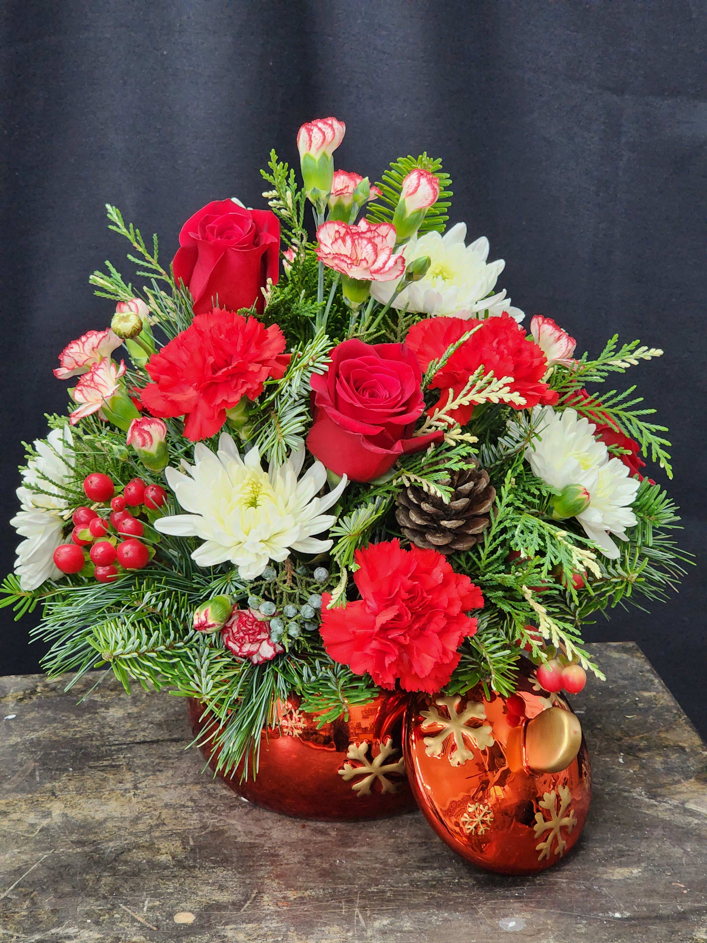 Ornament a glow - A beautiful keepsake ceramic ornament filled with fragrant pines, Carnations, mums, roses and berries. Makes a wonderful centerpiece anywhere in the home or office.