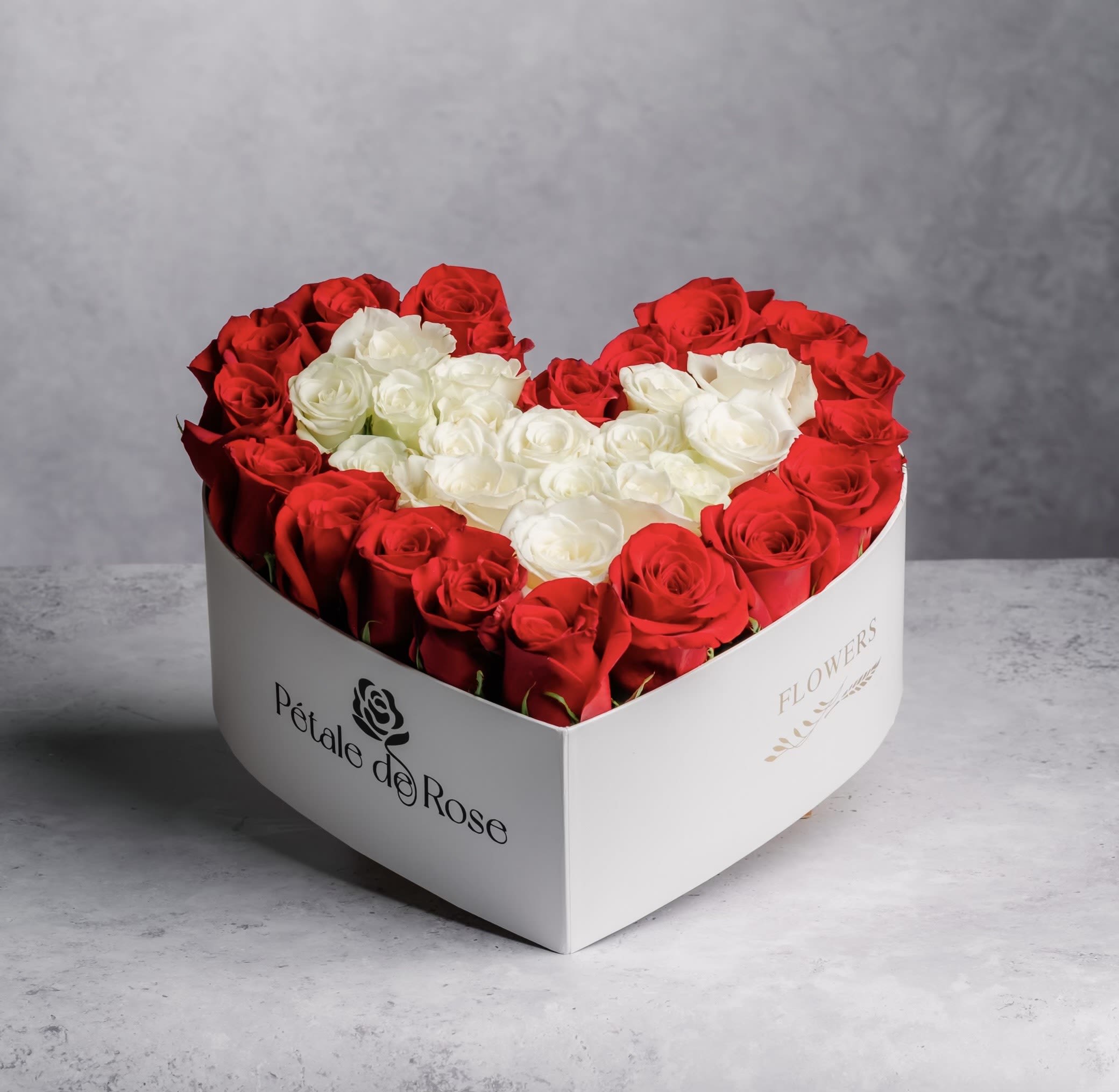 Red and White Heart - Surprise your loved one or your friend with one of our beautiful flower boxes. This year we have created new ideas, giving you gorgeous roses in a white heart shape box with Fresh Roses.