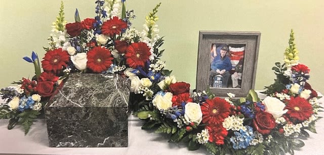 Patriotic Serpentine Urn Wreath S7 - Red, white, and blue flowers for a patriotic tribute