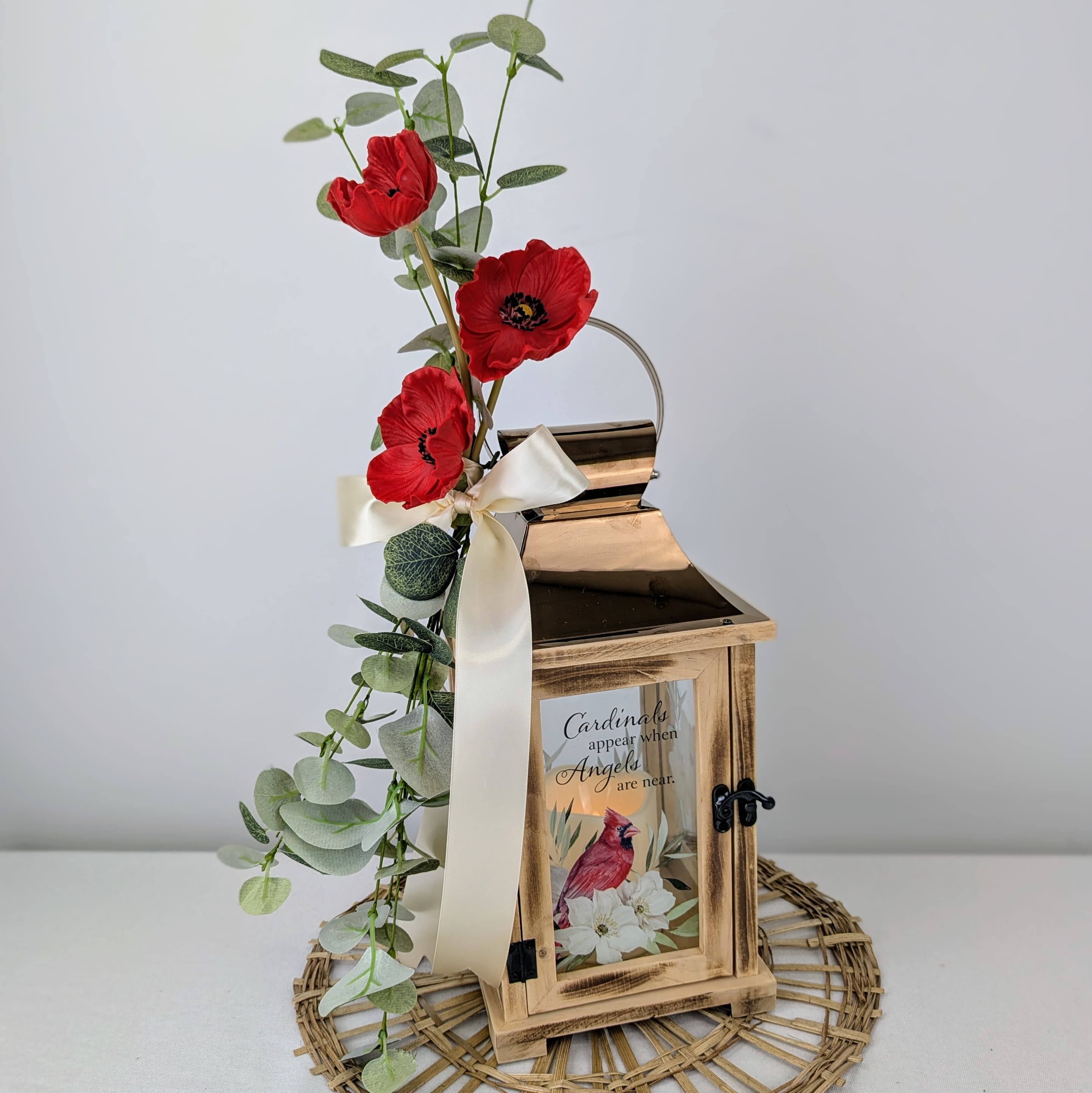 Lantern with Faux Flowers - Sympathy Lantern -- "Cardinals appear when Angels are near." Decorated with faux greenery/flowers and a ribbon.  Batteries included.
