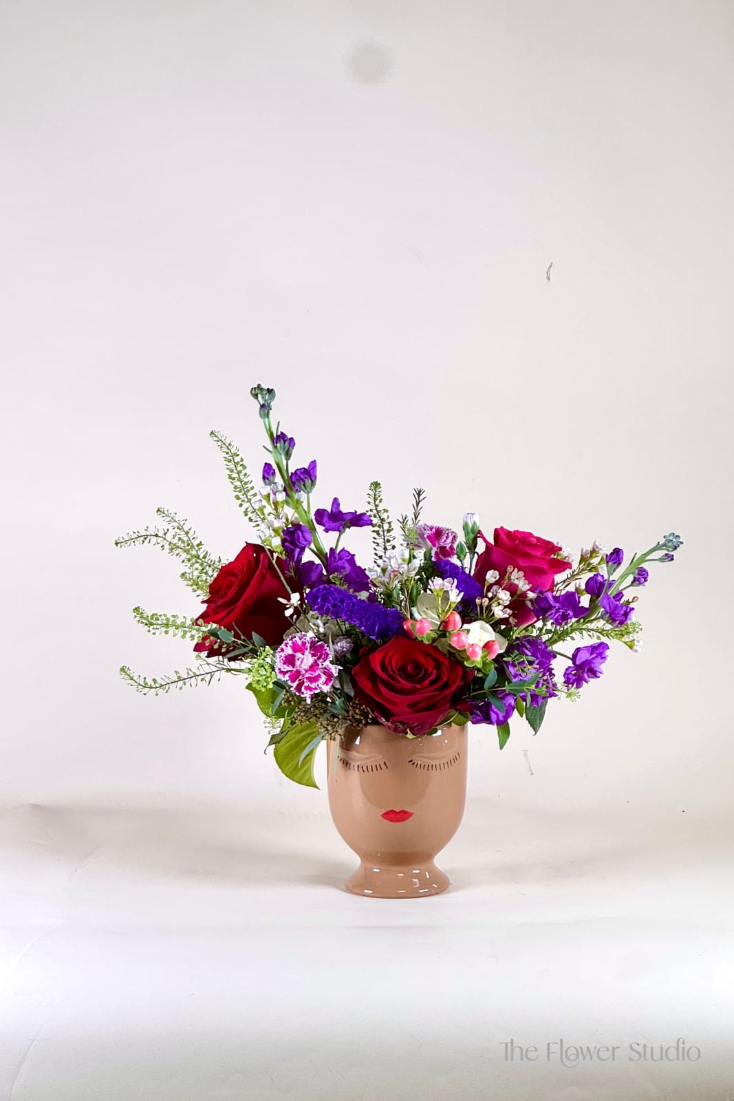 Selfie - Looking for something with personality? This one of a kind floral arrangement is styled in a modern ceramic face vase that brings character and charm to any space. Designed with an artistic touch and bursting with unexpected blooms and textures, it’s perfect for birthdays, spontaneous surprises, or simply saying, “you deserve something special.” Quirky, joyful, and full of life this is more than flowers; it’s a conversation piece.