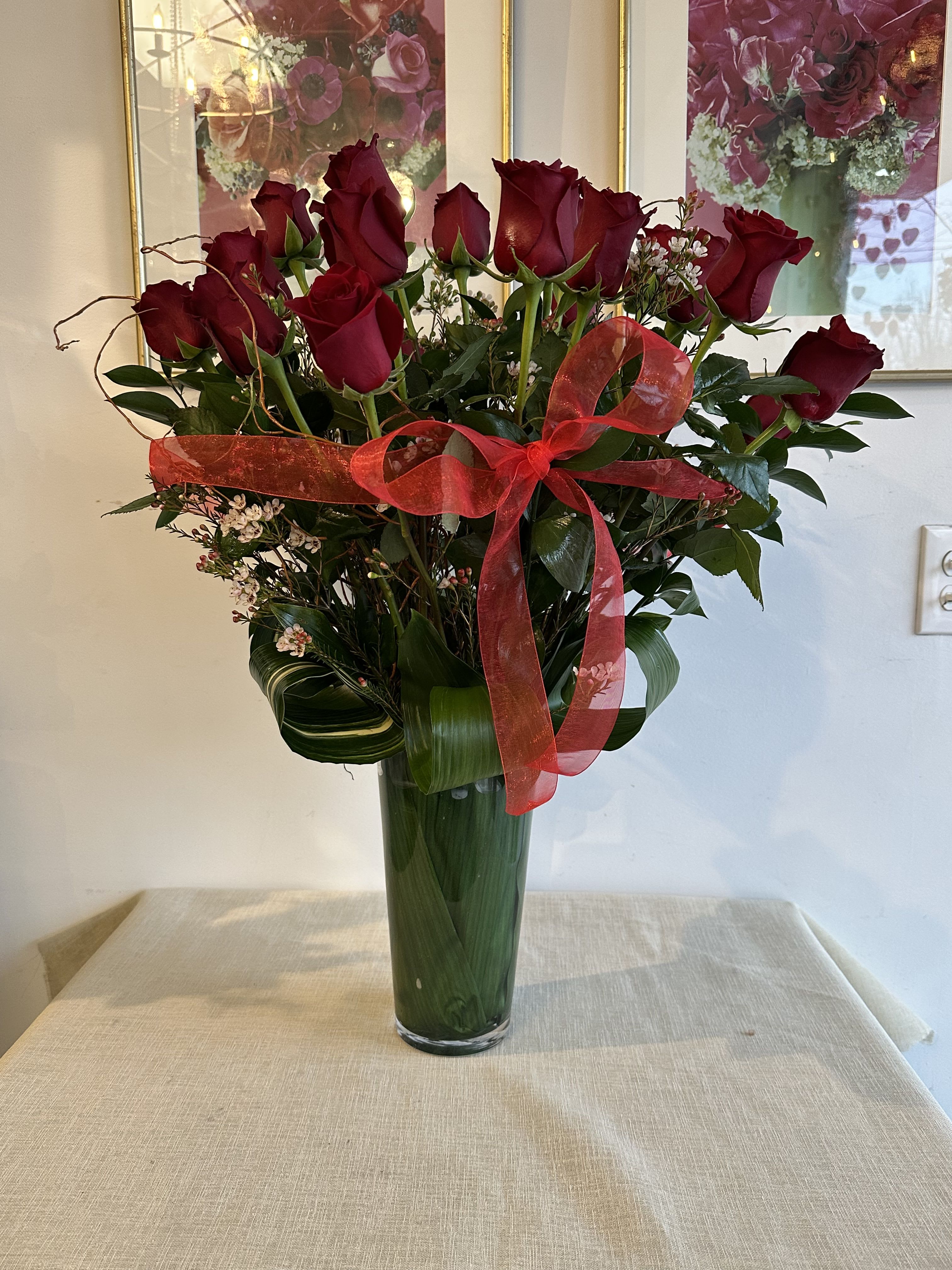 SWEETHEART (RED COLOR) LOVE, LOVE, LOVE  - these classic arrangements, accented with seasonal foliage, are available in three stunning options  *** Standard Version*** Dozen Long - Stemmed Roses   ***Deluxe Version*** Two Dozen Long - Stemmed Roses   ***Premium Version*** Three Dozen long Stemmed Roses 