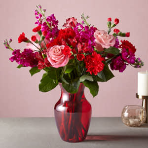 Cupid's Crush Bouquet - Take on the role of Cupid this Valentine’s Day with an arrangement that strikes all the right heartstrings. With a sweet disposition of pink and red flowers in a bold, red vase, love will instantly be in the air the moment these blooms arrive.