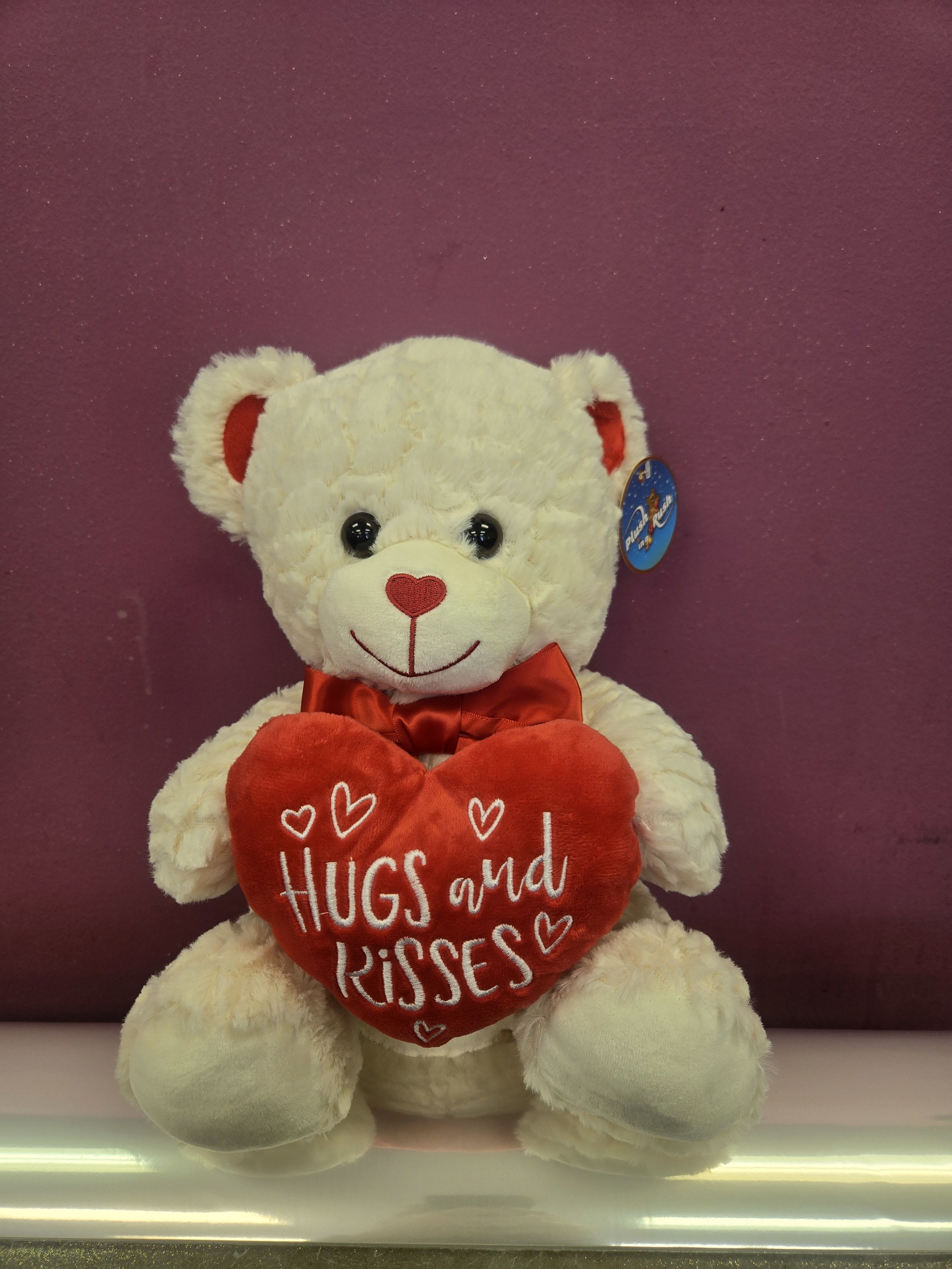 bear hugs and kisses - what a perfect way to send a cuddly hug with this 12" bear to that special someone ... attach it to a vase arrangement or to a bunch a balloons, either way a sure-fire way to send a smile 