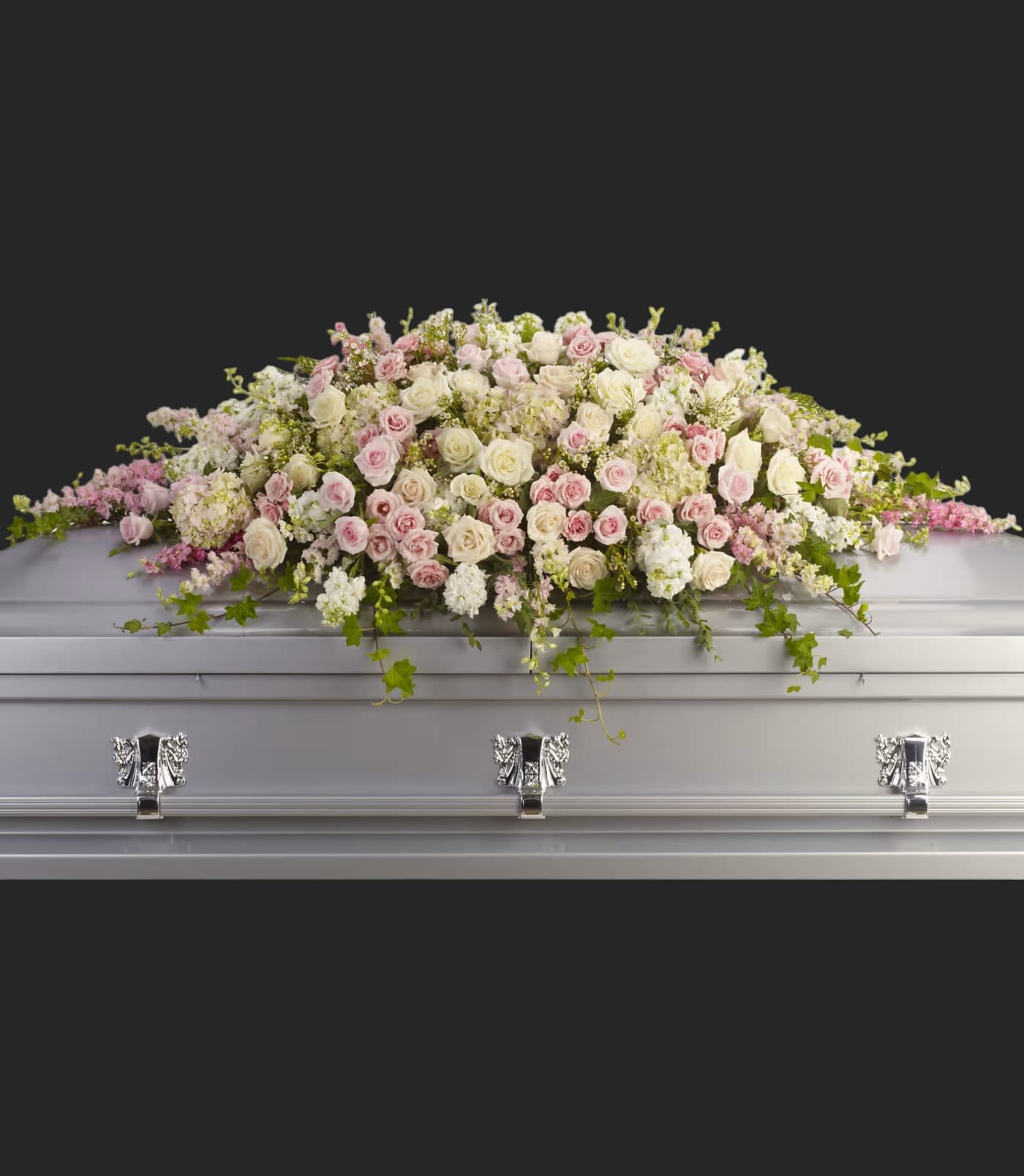 Always Adored Casket Spray - A beautiful spray of soft pink, white and crÃ¨me blooms ease the burden of loss.  