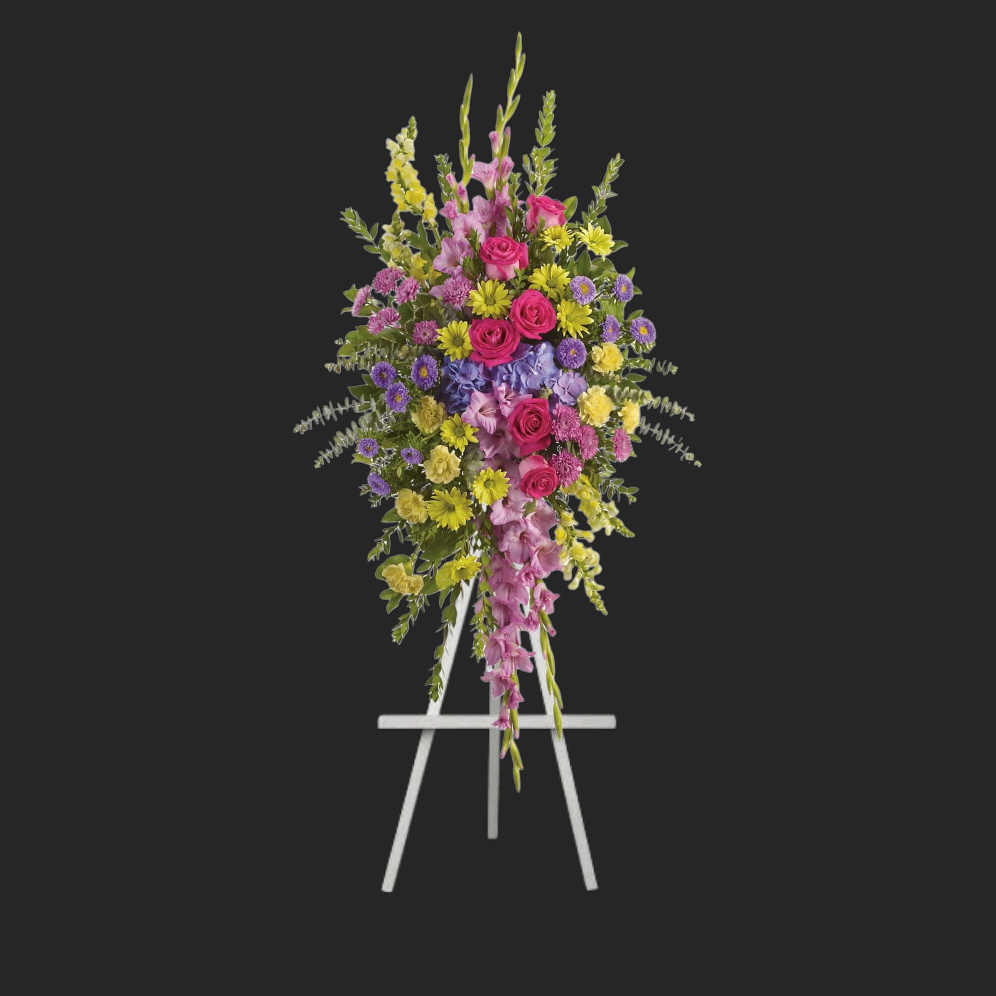 Bright and Beautiful Spray - Reflecting the many colors of life, a rich spectrum of blooms evokes the range of emotions experienced in remembering a cherished loved one.  