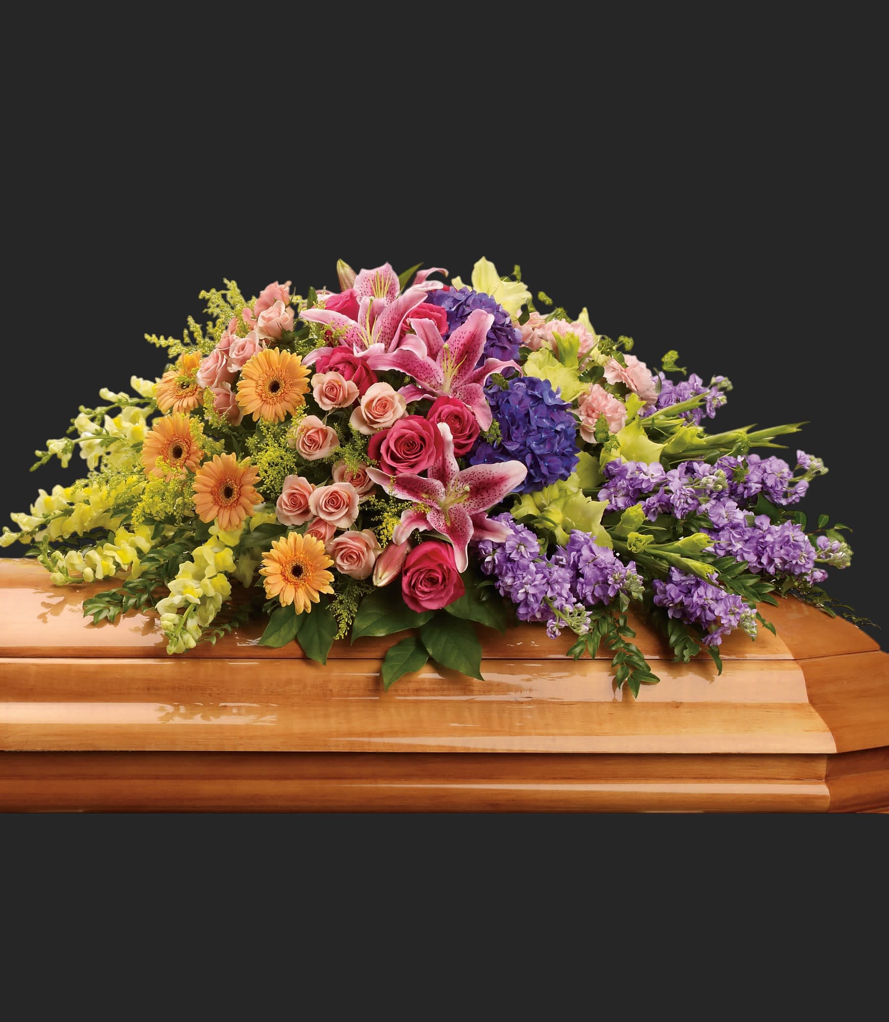 Garden of Sweet Memories Casket Spray - Bring a gentle radiance to the memorial service with this lovely multicolored casket spray of roses, lilies and other favorites. A beautiful way to honor the departed.  