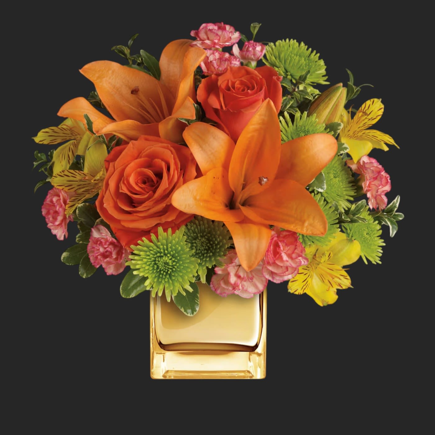 Tropical Punch Bouquet - Glow for it! Capture the magic of a tropical sunset with this gorgeously glowing bouquet. Lush lilies and roses in radiant shades of orange and yellow are presented in a golden Mirrored Cube for a touch of instant glam.  
