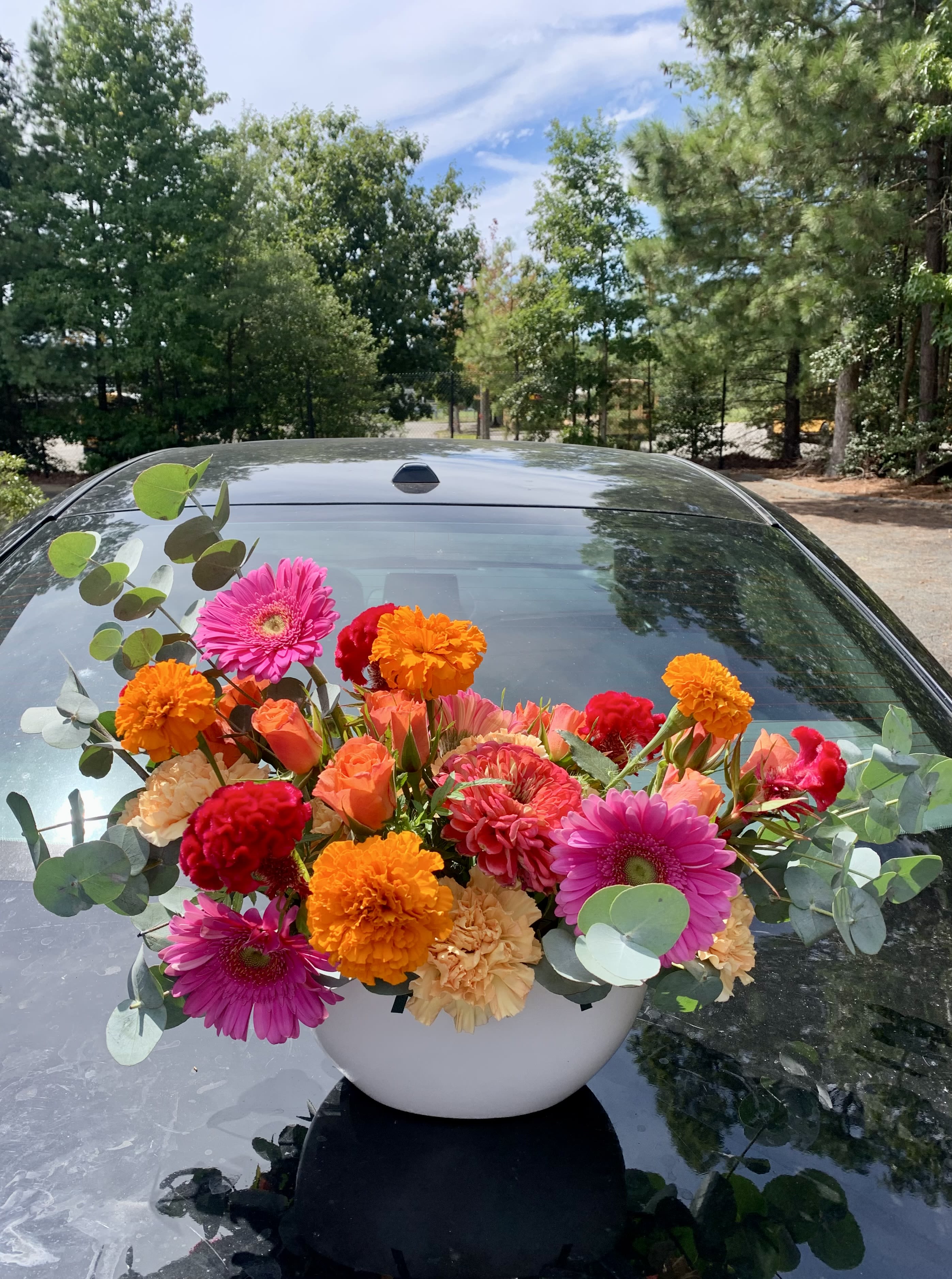 Marysol's Punch - This juicy summer arrangement sure does pack a punch! A fabulous mix of hot pinks, purples, and citrusy oranges styled in two sizes, depending on how Fancy you feel. Send this arrangement for celebrations, Thank You's, or just to brighten up your home.