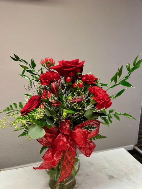 #4 Valentine arrangement  - All your favorite reds! Roses, carnations, alstroemeria, hypericum and filler! A great product to show someone that you love them! 