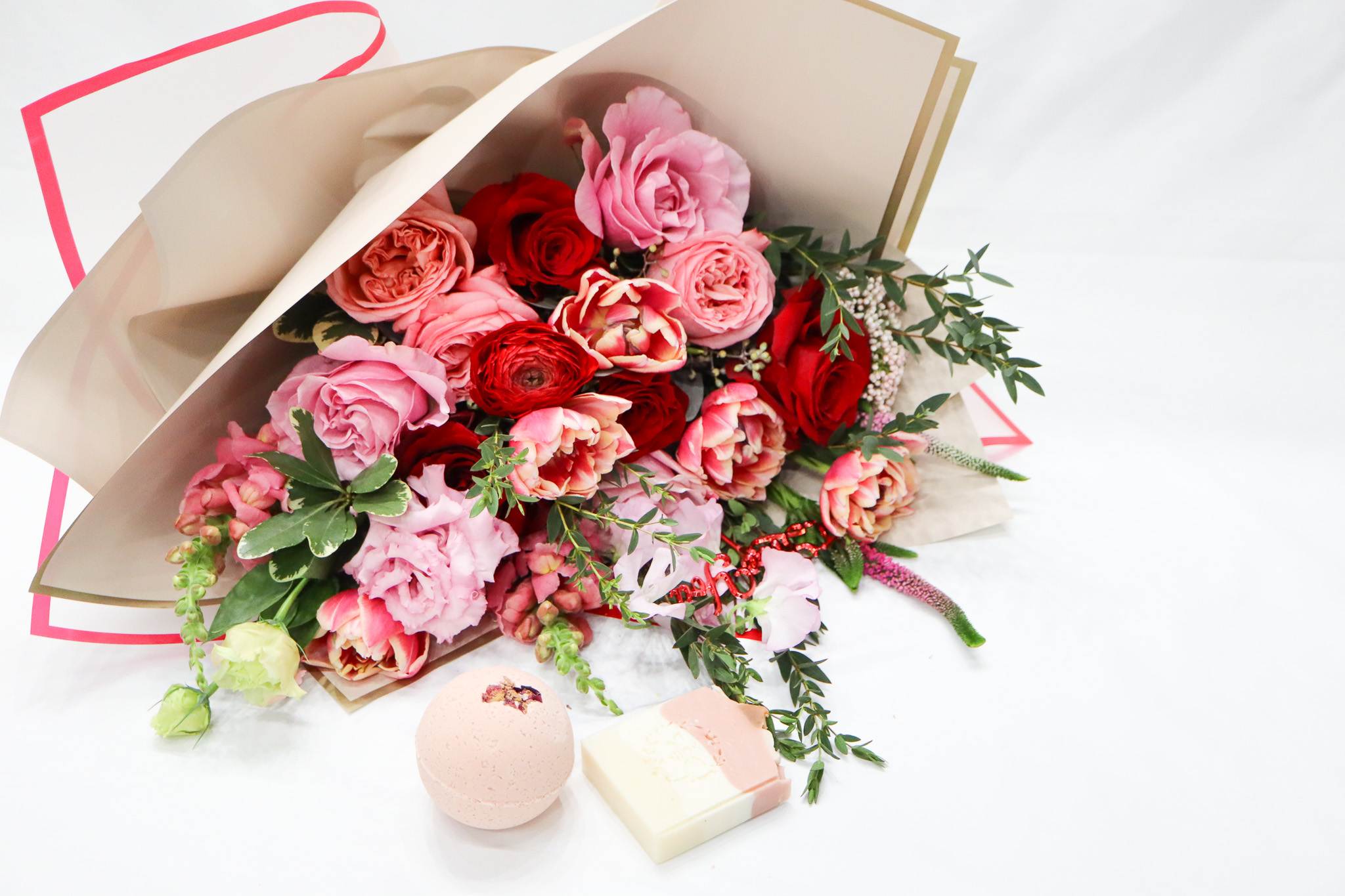 Forever &amp; Always - Forever &amp; Always is an elegant hand tied bouquet in pink and red, that comes with a beautiful all natural hand soap and a bath bomb.   