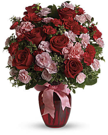 Dance with Me Bouquet with Red Roses - Fan the flames of love with this sizzling array of red roses and other romantic favorites in a chic ruby red vase. If you want to make a really big impression, surprise her with delivery to her office. Imagine the oohs and ahhs of her co-workers - and her. This gorgeous bouquet includes red roses, red carnations, light pink carnations, red miniature carnations, light pink miniature carnations and green rhamnus accented with assorted greenery and a pink satin ribbon. Delivered in a ruby rose vase.