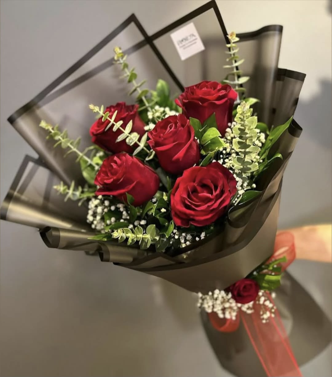 "The Half-Dozen Dream" - "A delicate half-dozen rose bouquet, masterfully wrapped in premium Korean paper with a signature ribbon bow and curated greenery."