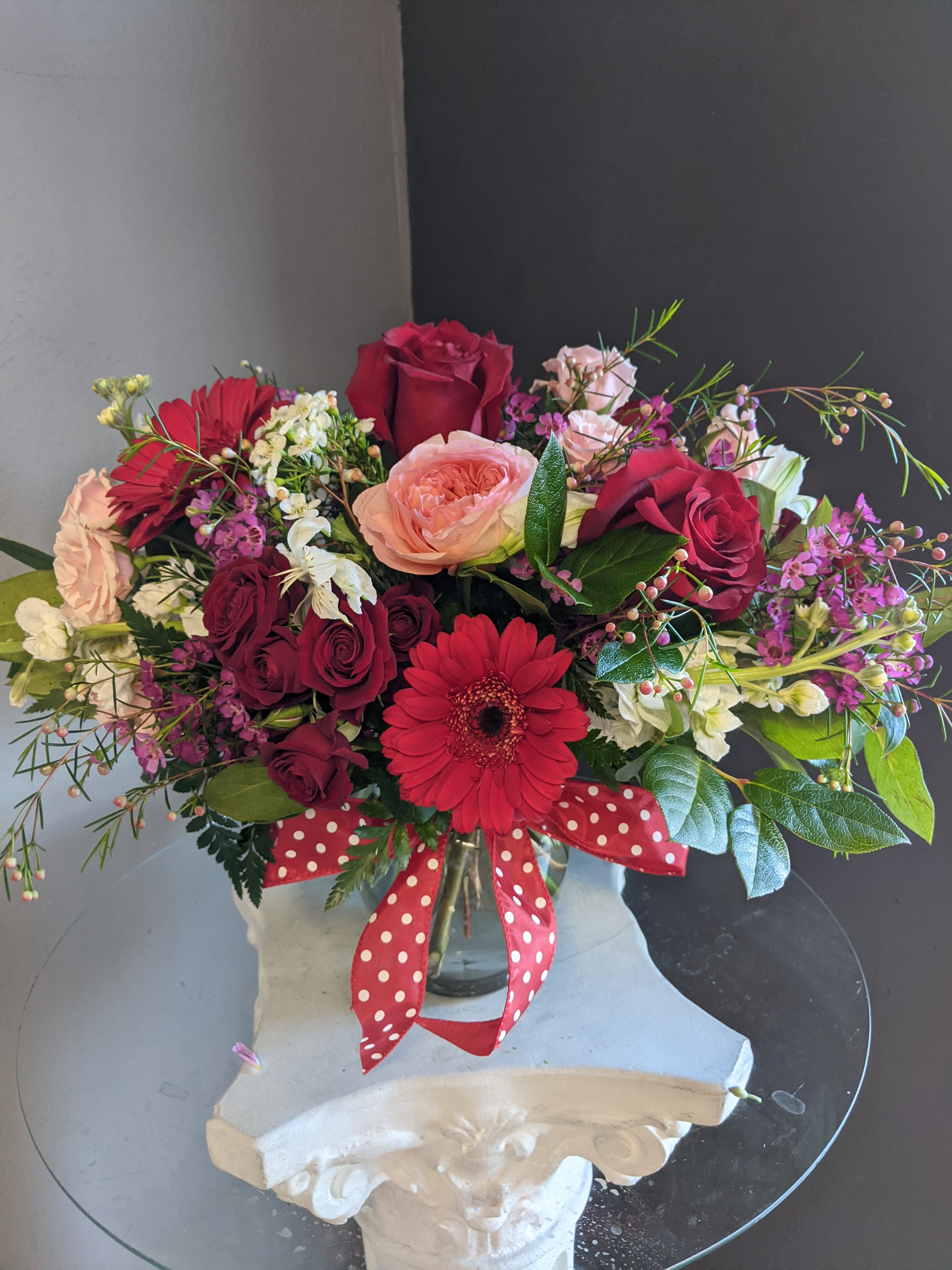#128 Winter Floral Arrangement  - A beautifully selected bunch of the freshest flowers in a vase uniquely arranged by hand.