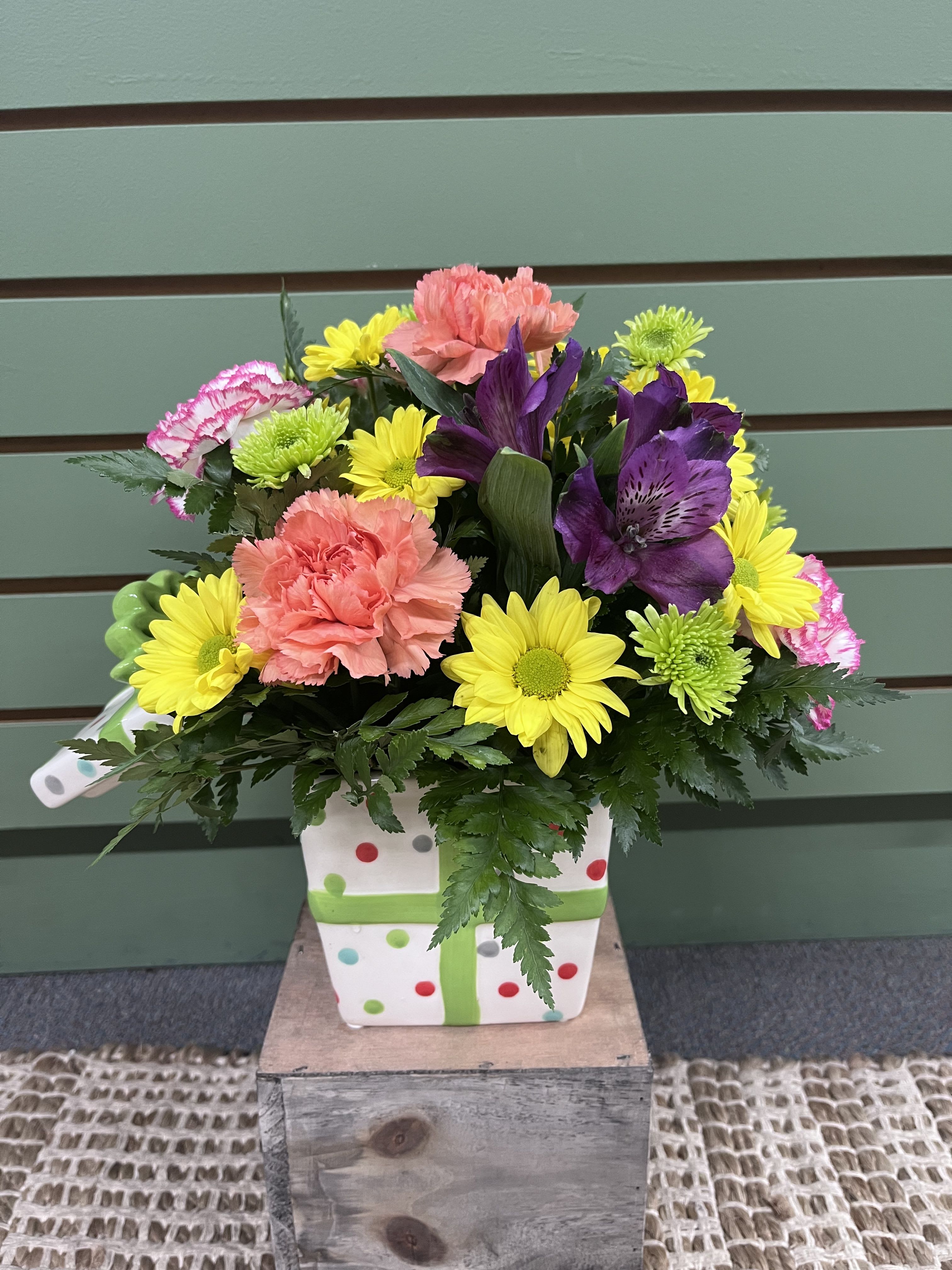 Birthday Bash by Brians Floral - Celebrate a Birthday Bash With a pretty Splash of Flowers!! This fun &amp; Festive arrangement features the freshest and brightest mix of Mums, carnations and alstroemeria. Standard size shown is aprox 12"x12" with fuller options available in our deluxe and premium options. 